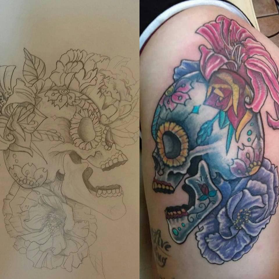 Skull with flowers Chicano tattoo on the shoulder by @juiceinkythings