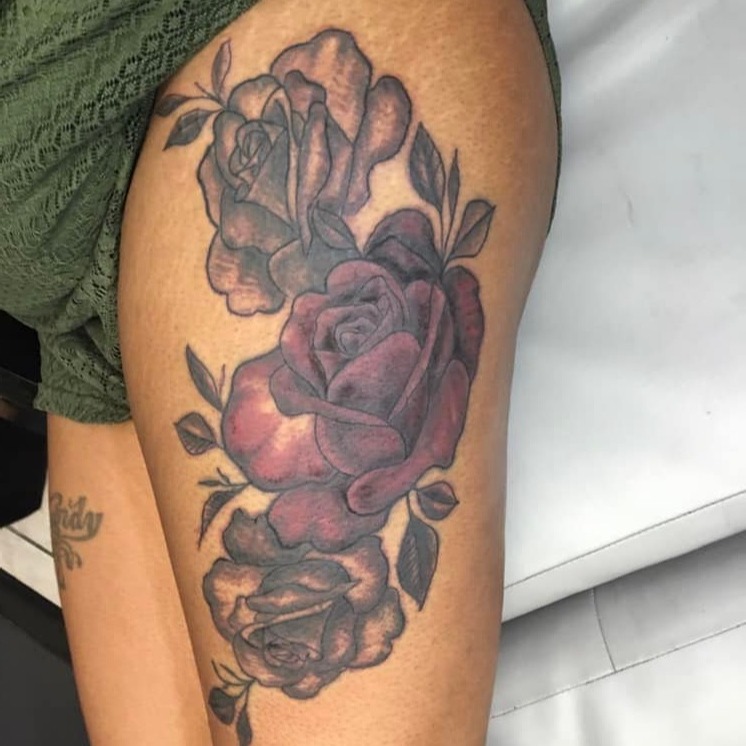 Roses black and grey tattoo on the thigh by @juiceinkythings