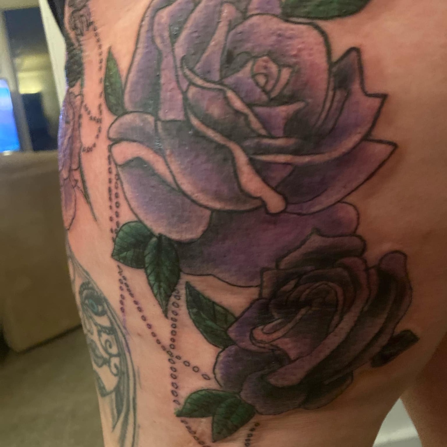 Purple roses dotwork tattoo on the upper arm by @juiceinkythings