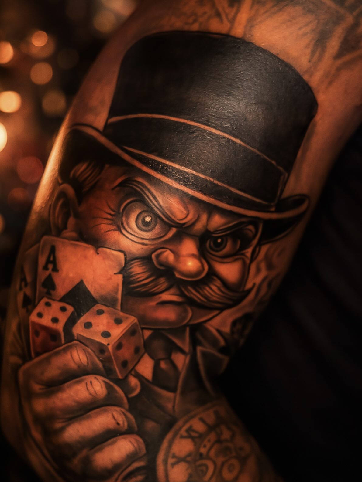 Gangster with cards and dice realism tattoo on the forearm by Shane Boss, Toronto, Ontario