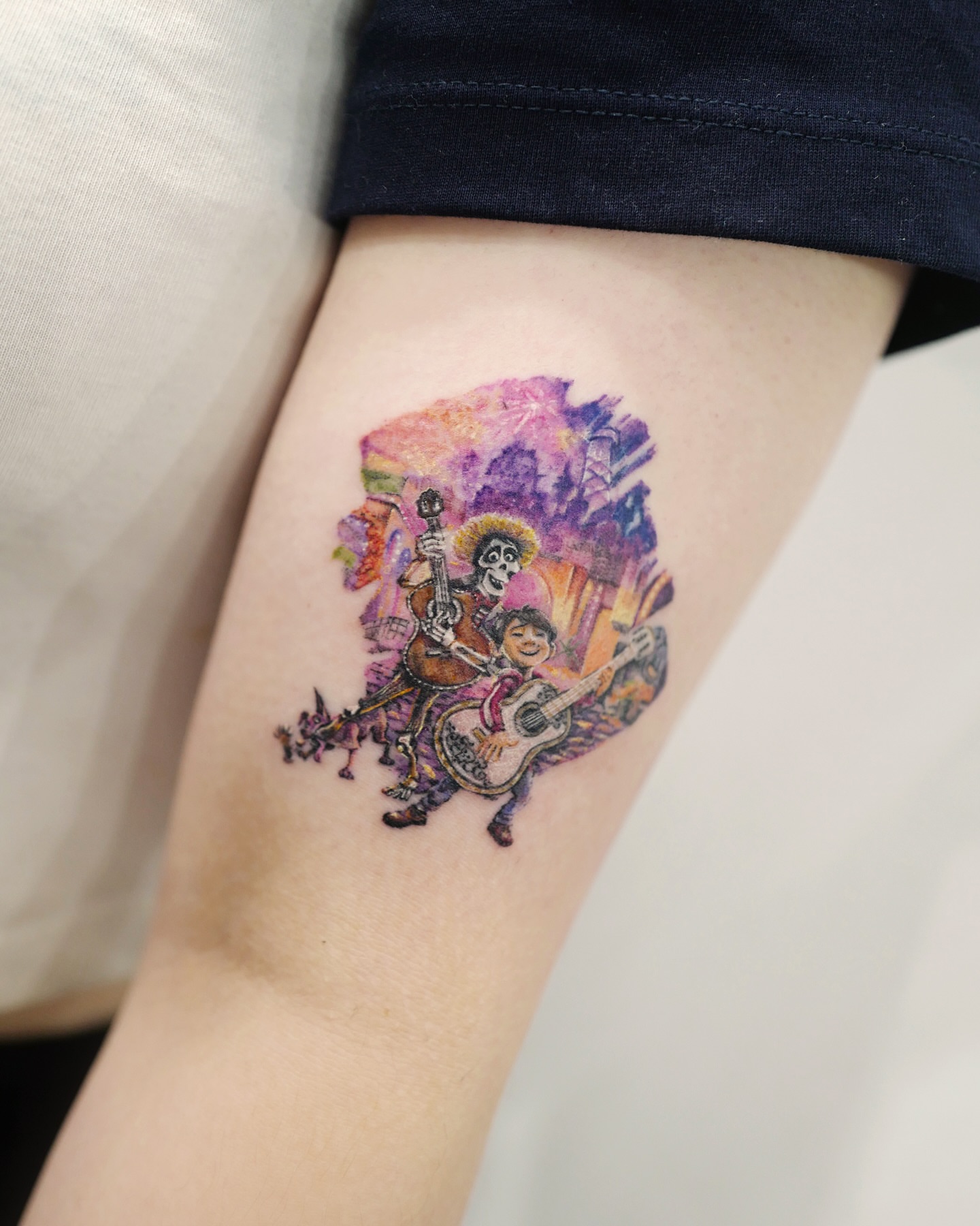 Musician and child watercolor tattoo on the forearm by YUN