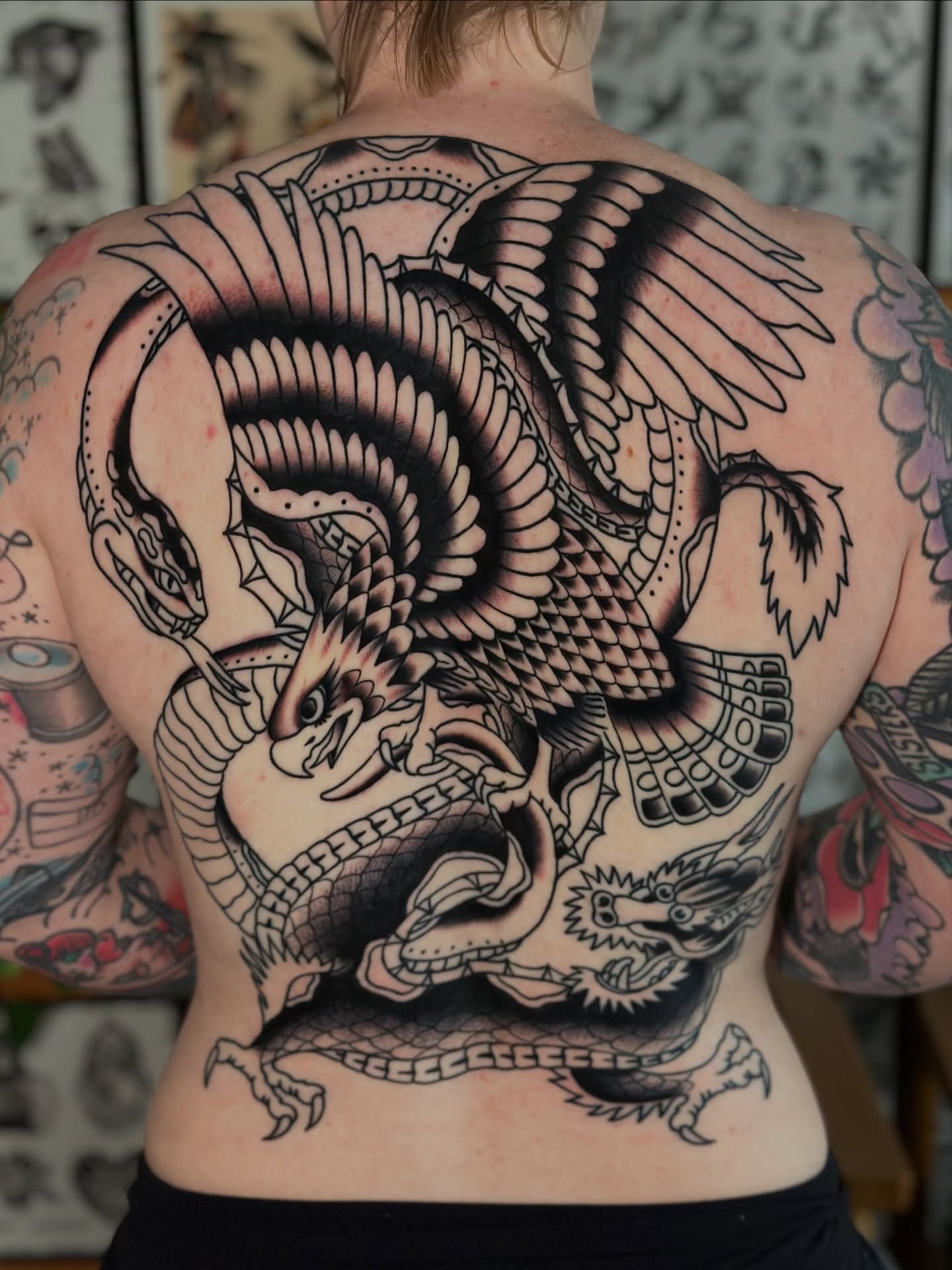 Dragon black and grey tattoo on the back by Michael Williams