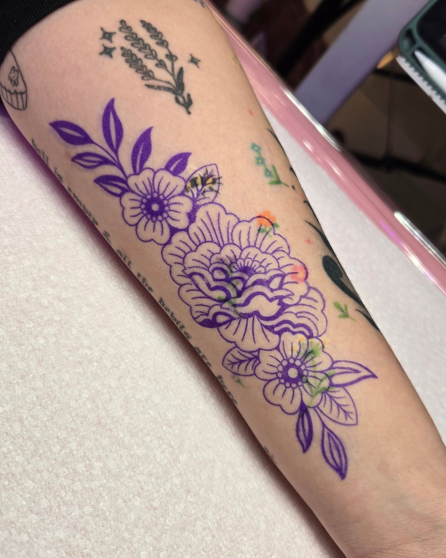 Floral bouquet new school tattoo on the forearm by Kirstie Lew Tattoo
