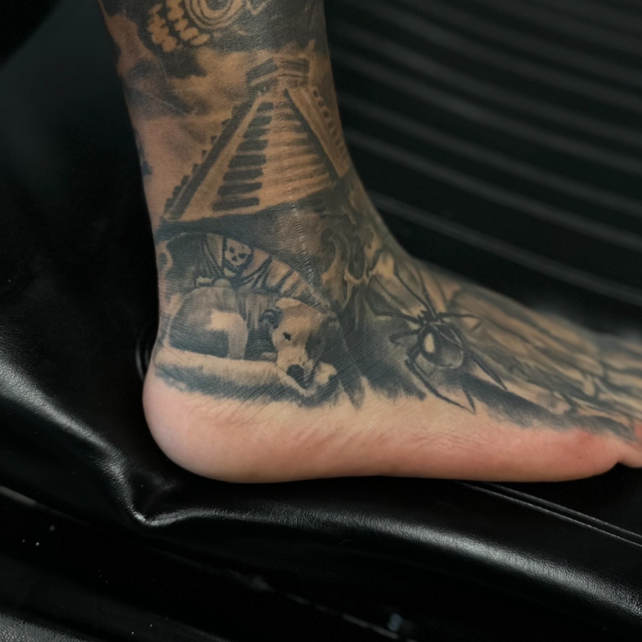 Dog and spider black and grey tattoo on the foot by Lex⛓️