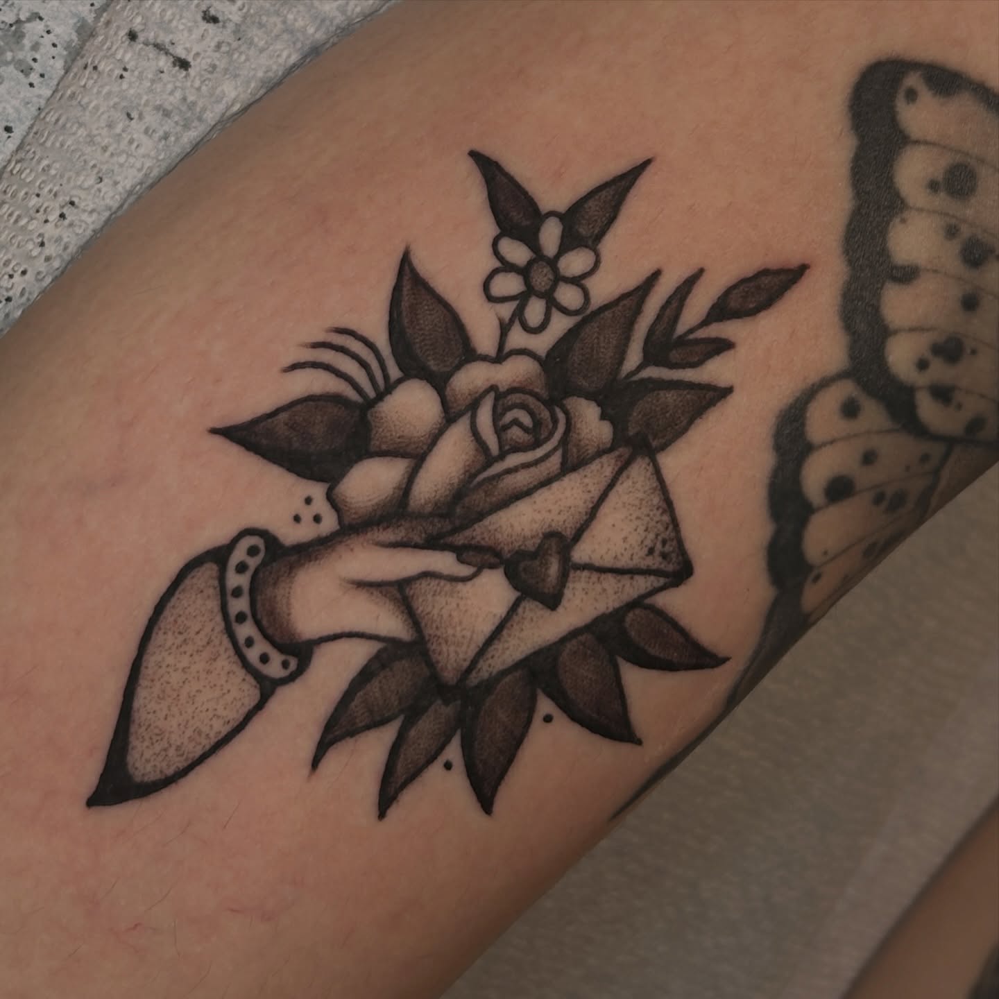 Rose and envelope dotwork tattoo on the forearm by Kat McCoy Guidera, Nashville, Tennessee