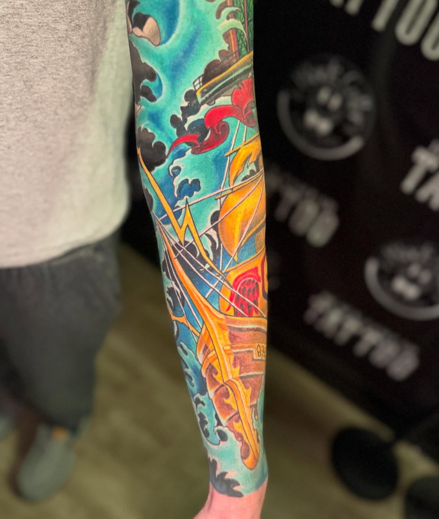 Ship and waves new school tattoo on the forearm by InkFloyd Roith