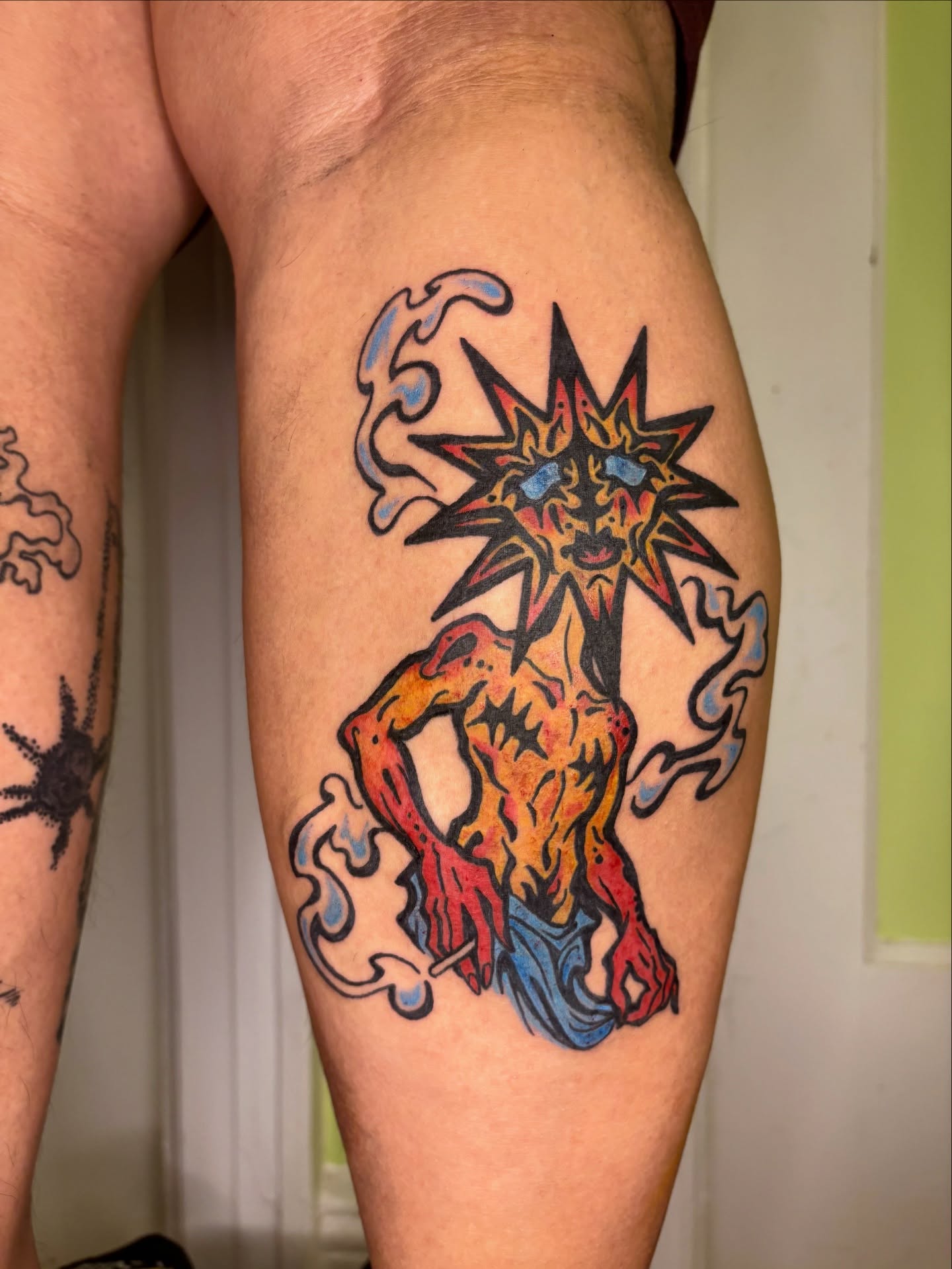 Sun-like creature new school tattoo on the thigh by Grae