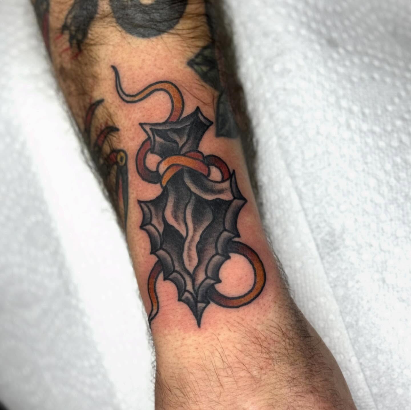 Cross with ornamental details American traditional tattoo on the forearm by Domanick Libretti, Nashville, Tennessee