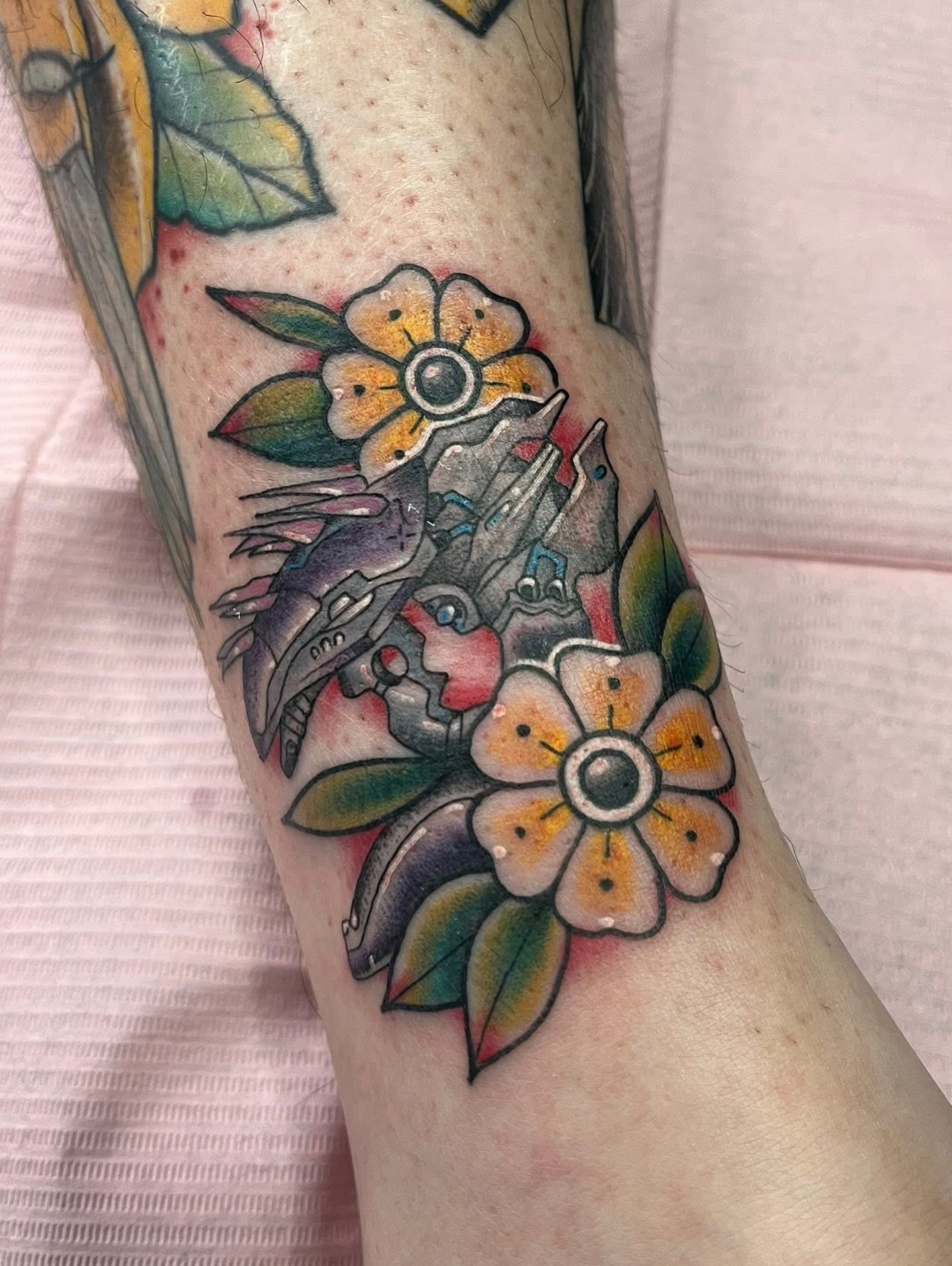 Flowers and bird American traditional tattoo on the forearm by Timmy
