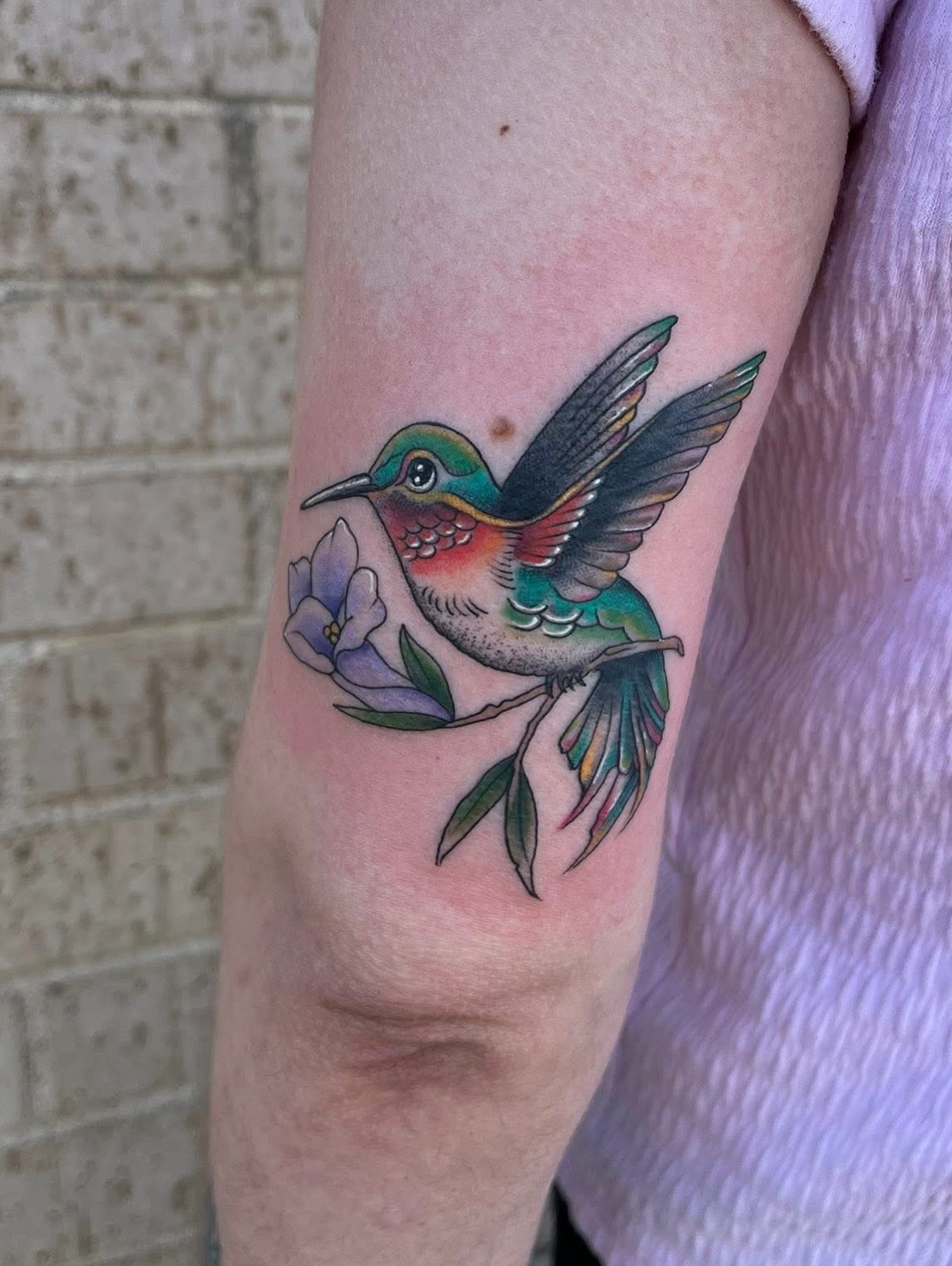 Hummingbird and flowers realism tattoo on the forearm by Timmy
