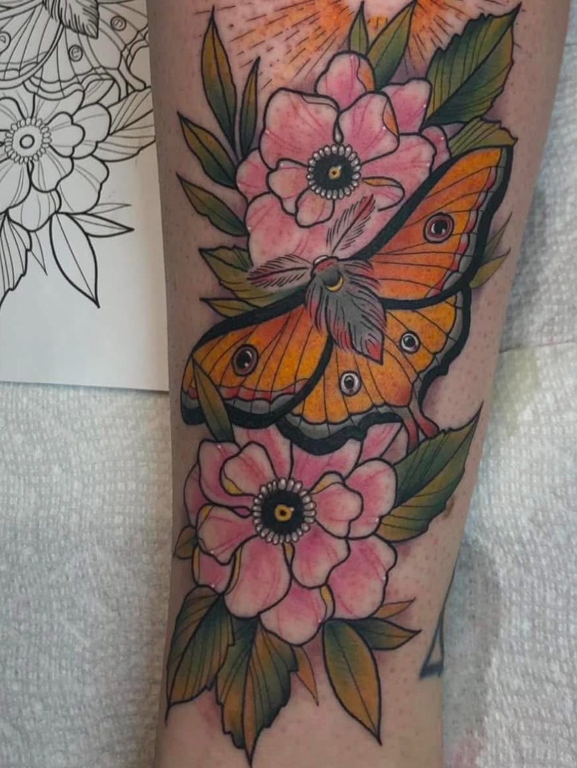 Butterfly and flowers American traditional tattoo on the forearm by Timmy