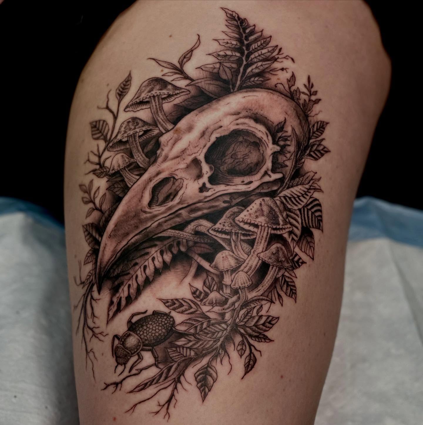 Bird skull and mushrooms realism tattoo on the thigh by Dylan Curry