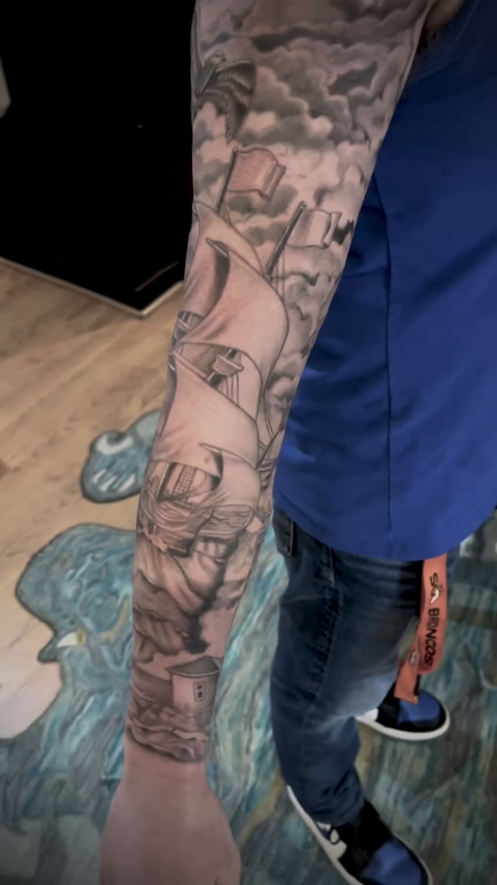 Nautical sleeve with ships and lighthouse Japanese tattoo on the upper arm by Ashly Hutchens, Richmond, Virginia