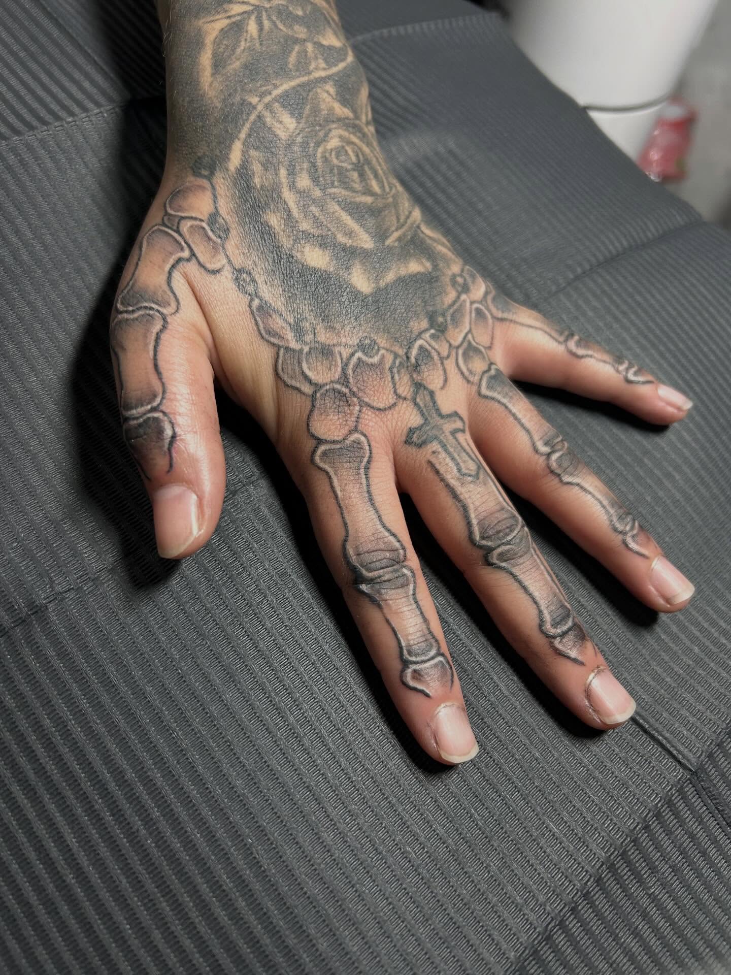 Skeleton hand black and grey tattoo on the hand by Felix perez (Tattooer)