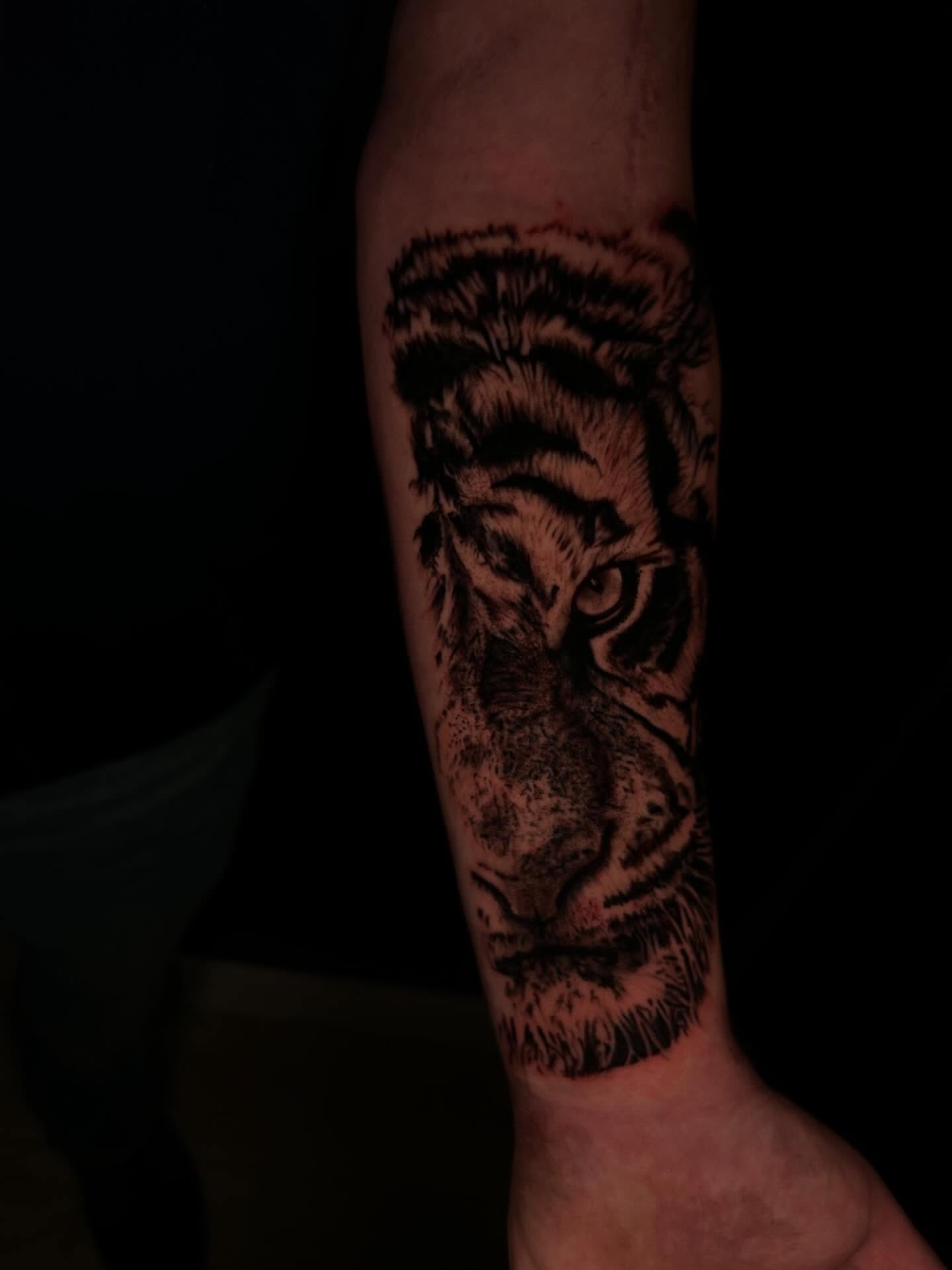 Tiger dotwork tattoo on the forearm by Joey-tattoo Artist