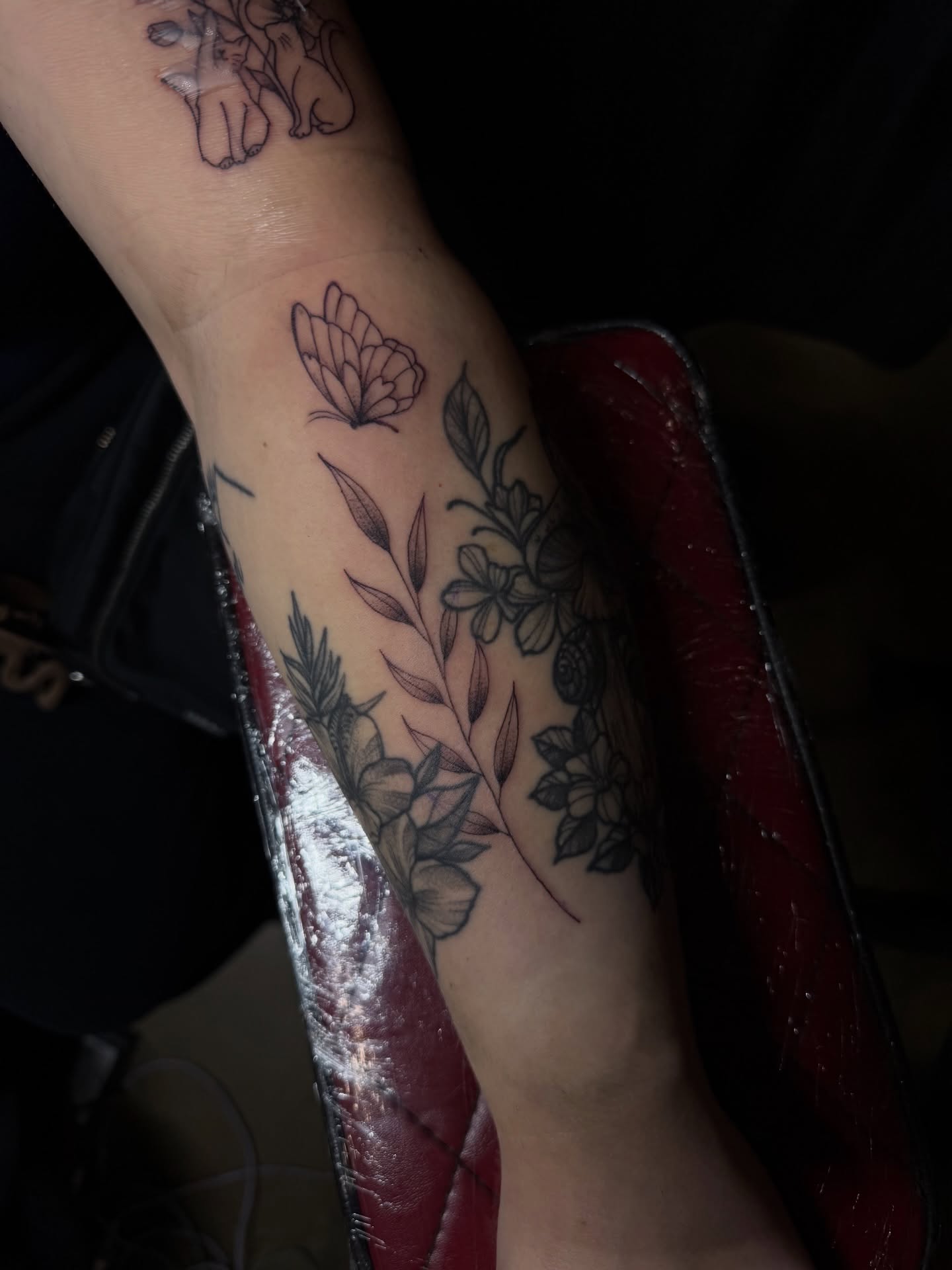 Floral arrangement black and grey tattoo on the forearm by Los Angeles Tattoo Artist