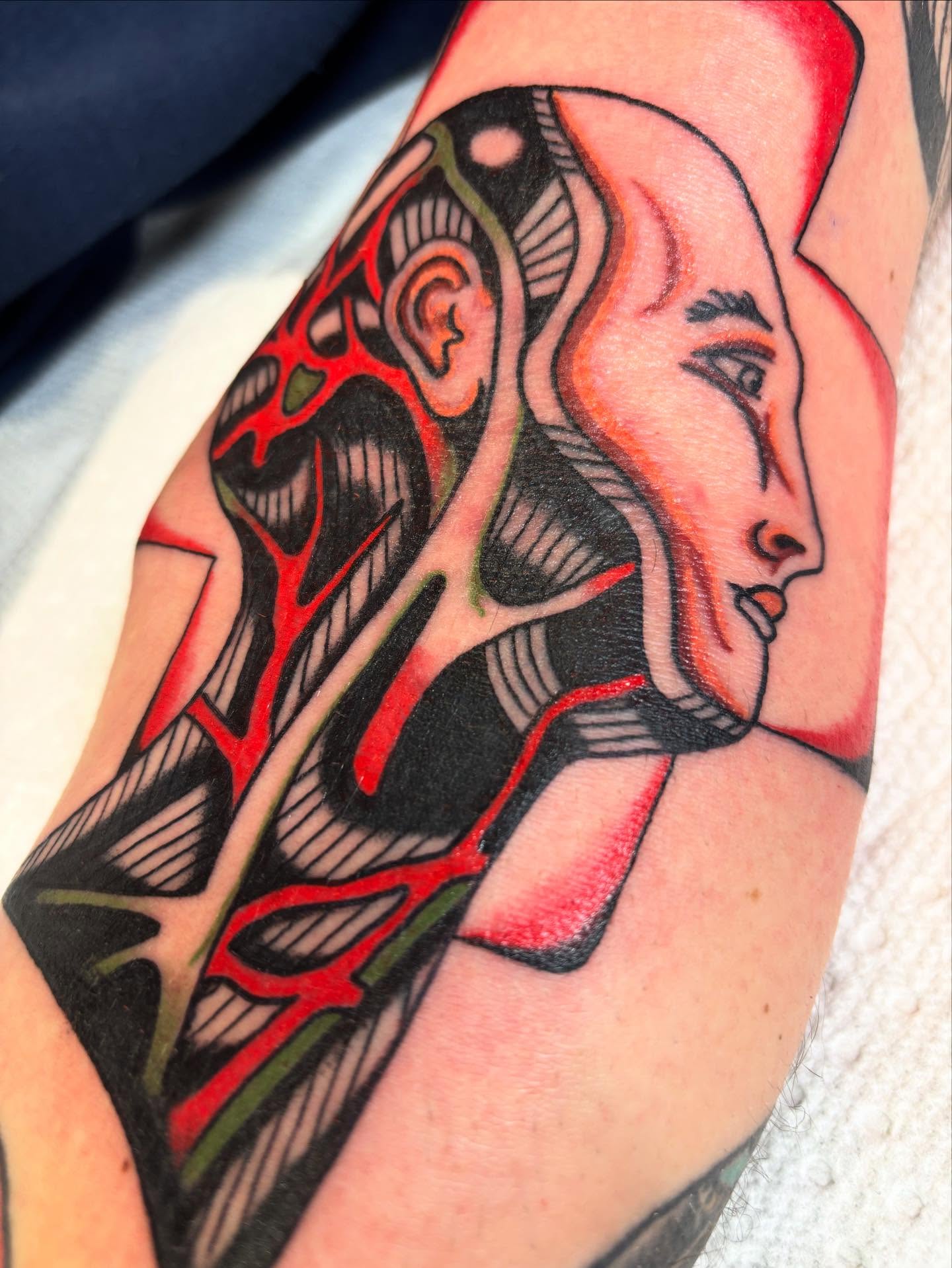 Abstract woman geometric tattoo on the forearm by dayton skuse, Portland, Oregon