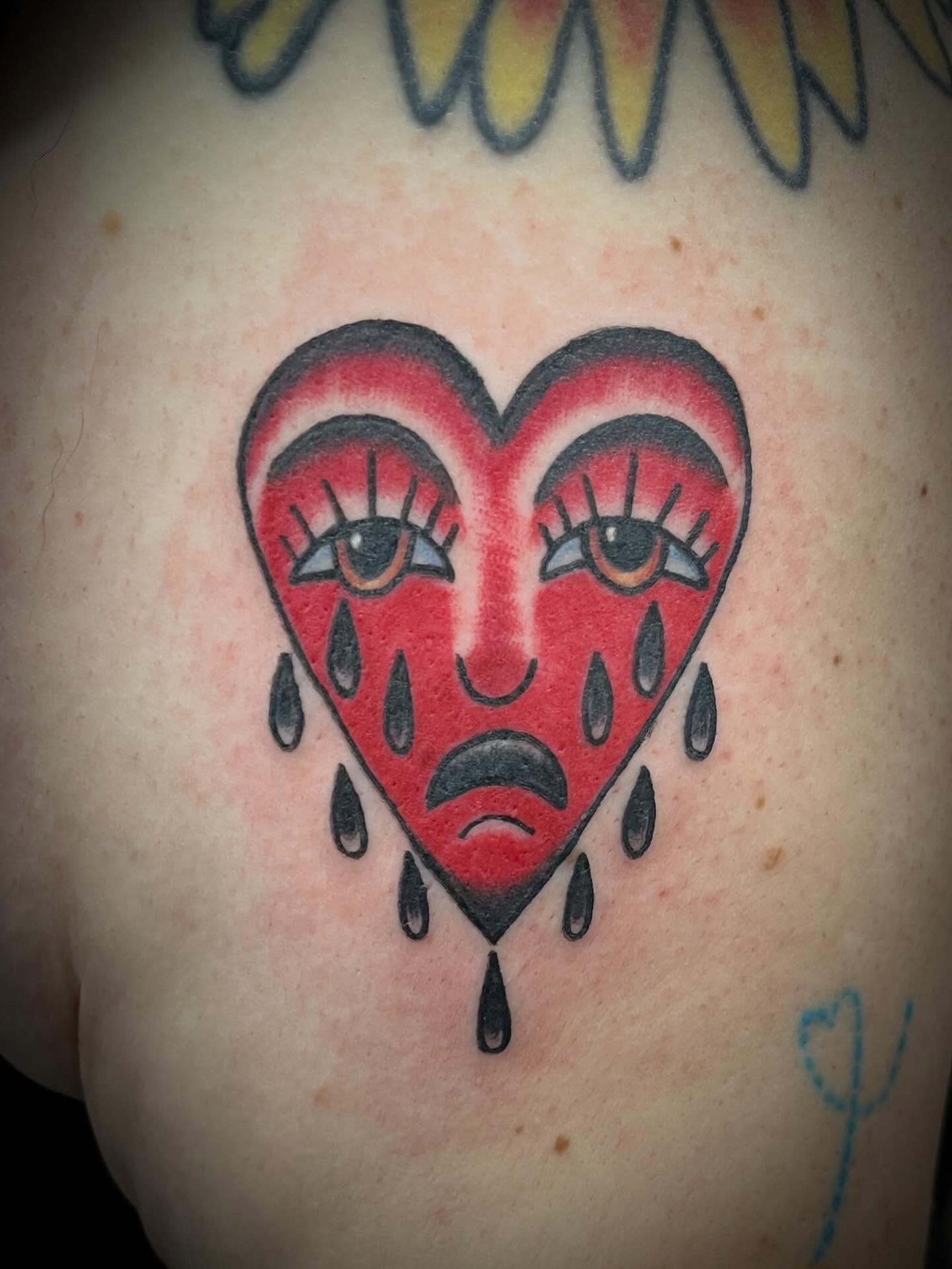 Crying heart American traditional tattoo on the chest by Hit & Run Tattoo, Dayton, Ohio