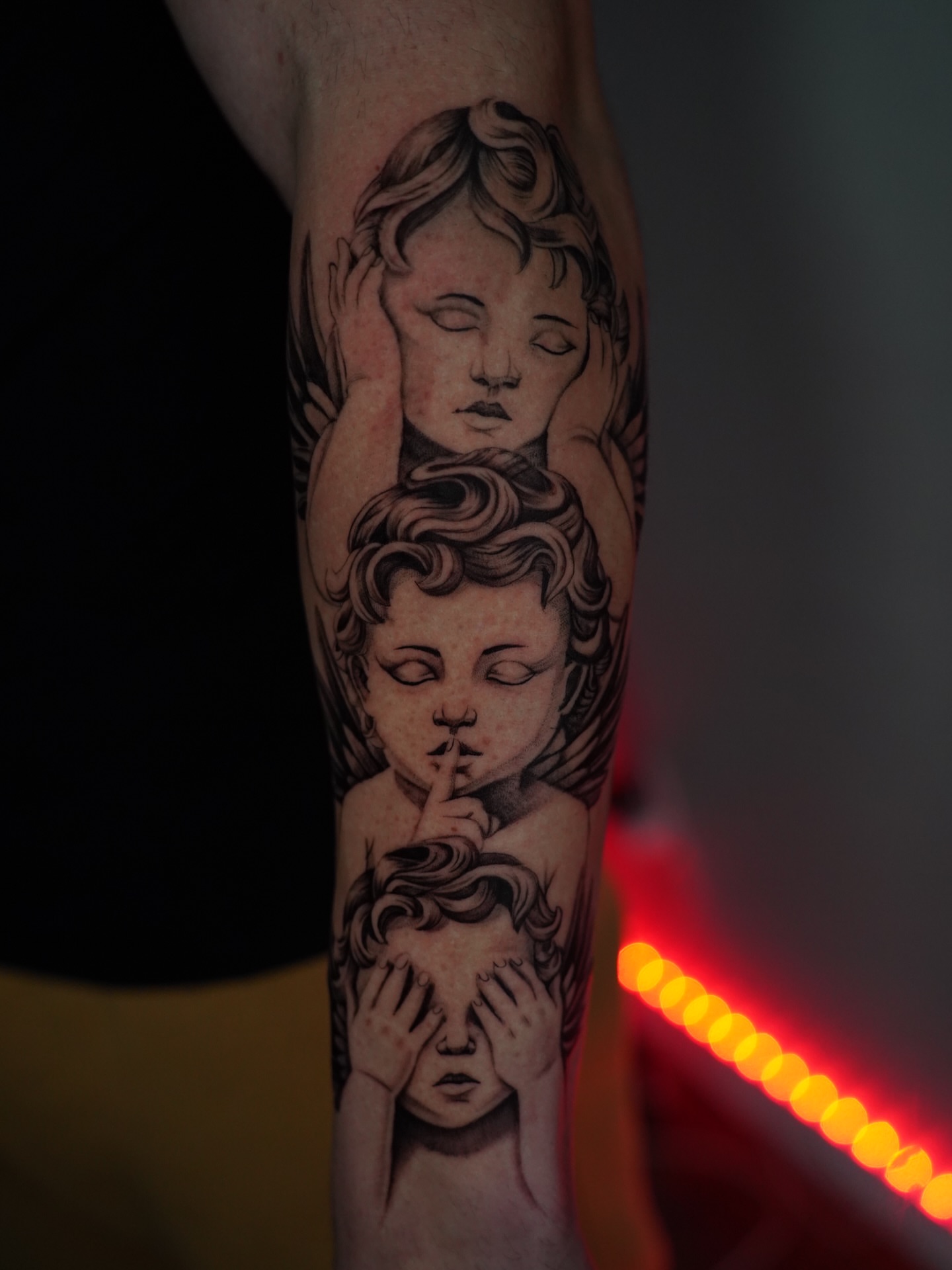 Angels realism tattoo on the forearm by Dallas Tattoo Artist