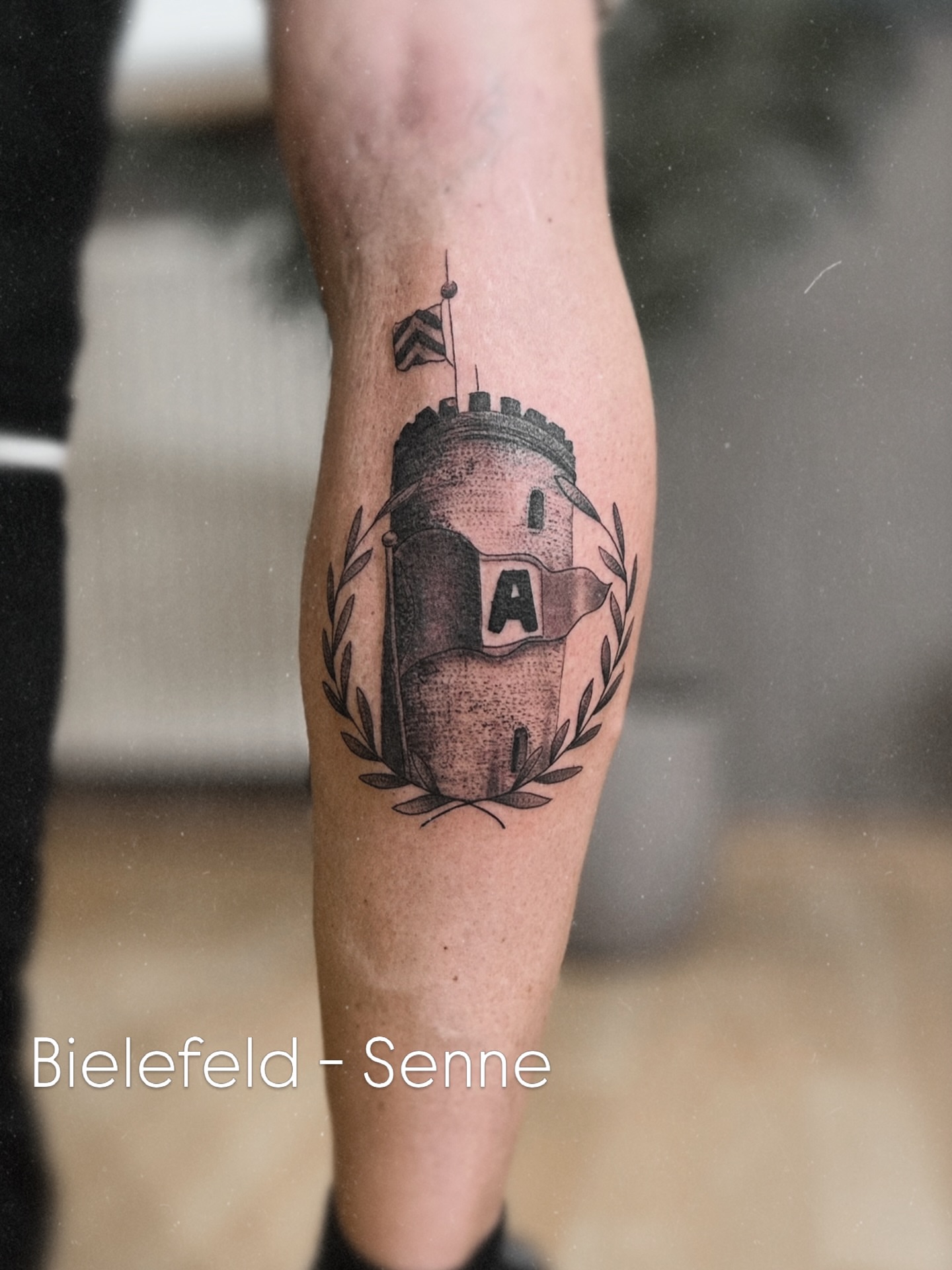 Castle tower black and grey tattoo on the forearm by Die Ivo, Bielefeld, Germany