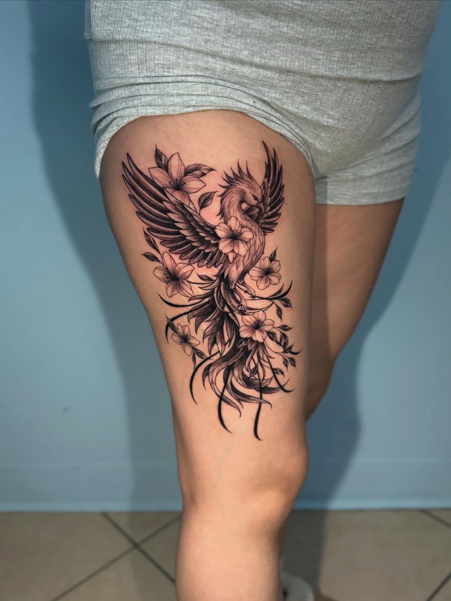 Floral phoenix black and grey tattoo on the thigh by Stilow Memphis Tattoo Artist, Memphis, Tennessee