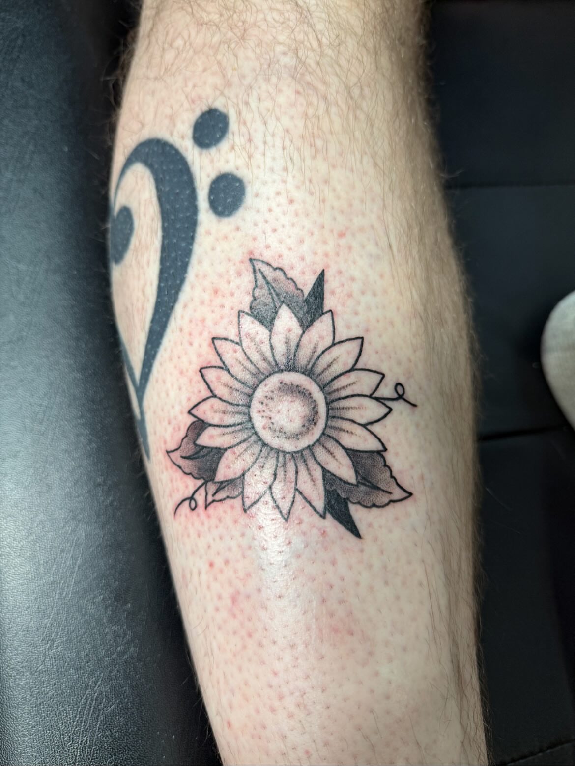 Sunflower black and grey tattoo on the forearm by Shay - Mandeville Tattoo Artist
