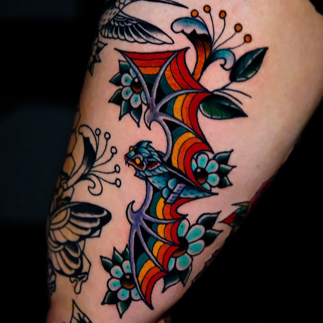 Dragon and flowers American traditional tattoo on the forearm by Don Boos Tattoos