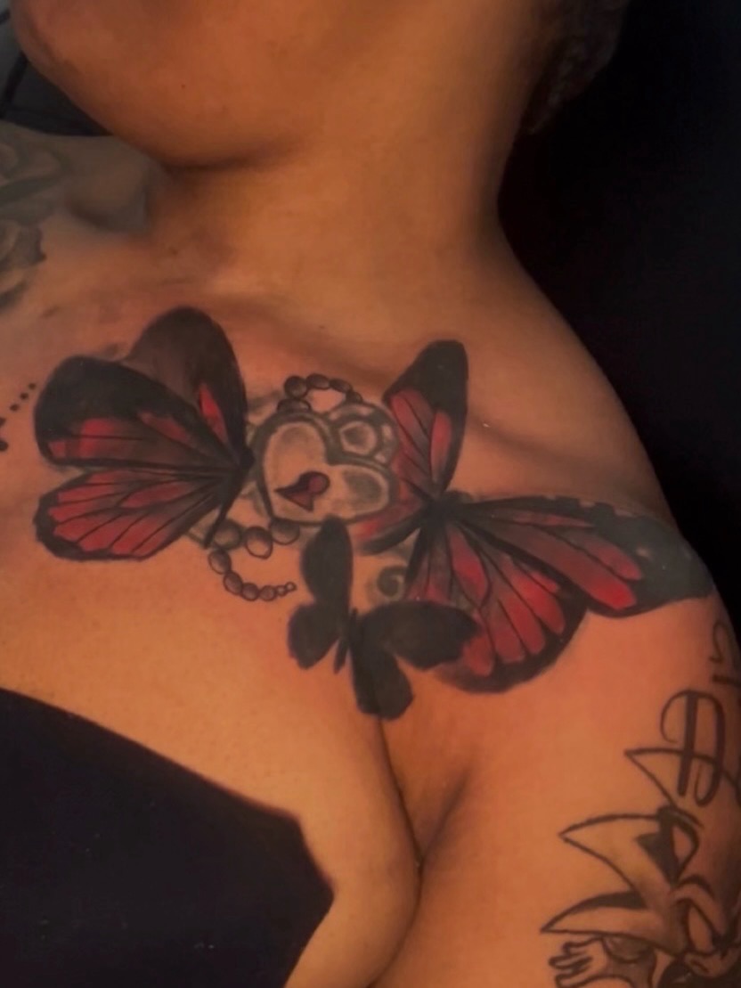 Butterfly dotwork tattoo on the chest by Female Cleveland Tat Artist ๐