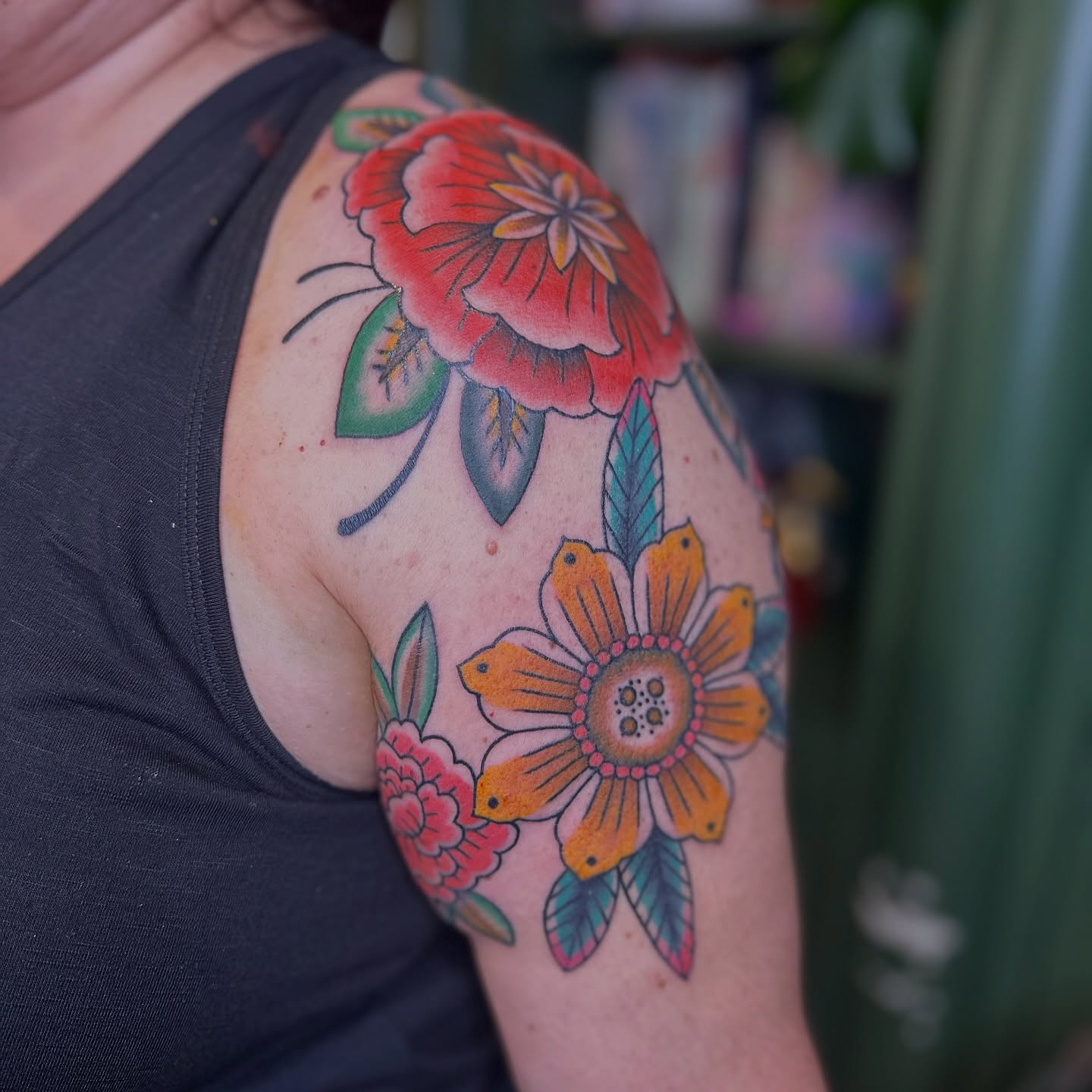 Floral arrangement American traditional tattoo on the shoulder by Brieana Smith