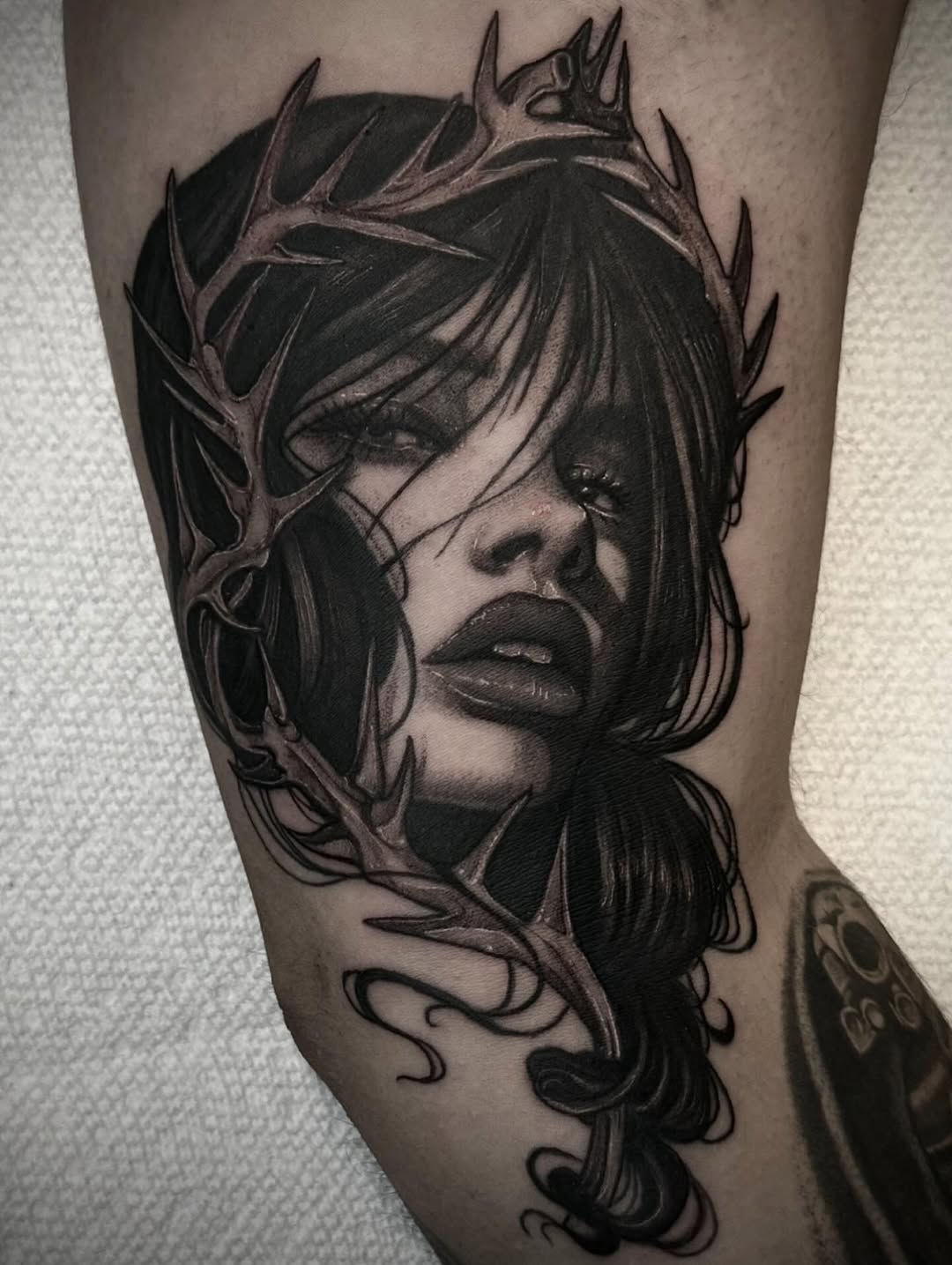 Woman with thorny crown realism tattoo on the forearm by Mandi Marie, Charlotte, North Carolina