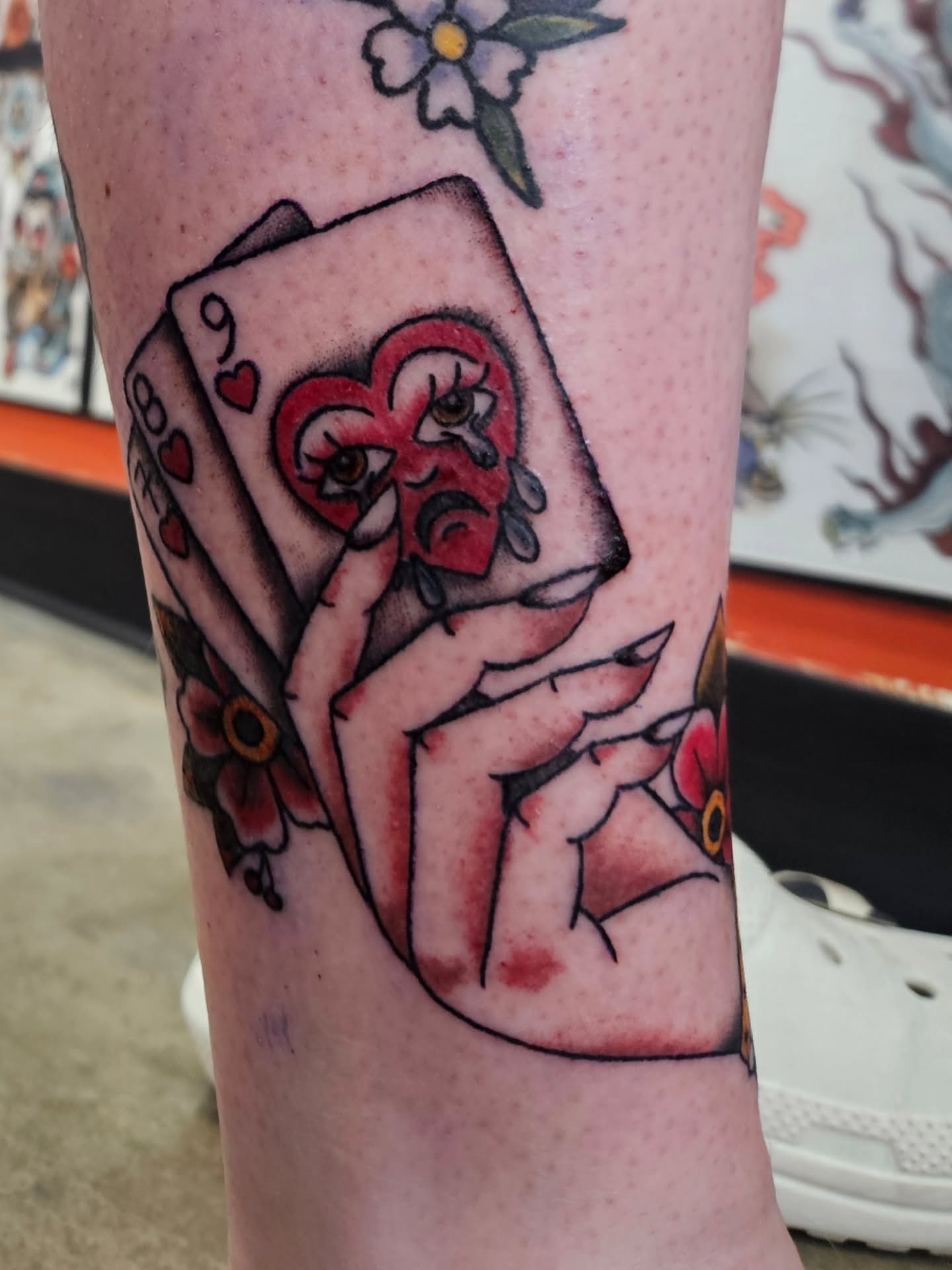 Playing card with face American traditional tattoo on the forearm by MK Stevens - Greeley Based Tattoo Artist