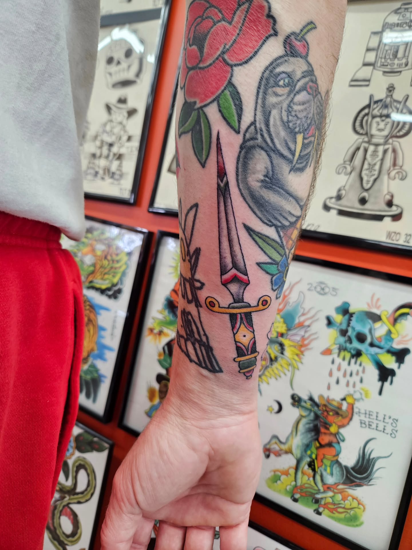 Rose and monkey American traditional tattoo on the forearm by MK Stevens - Greeley Based Tattoo Artist