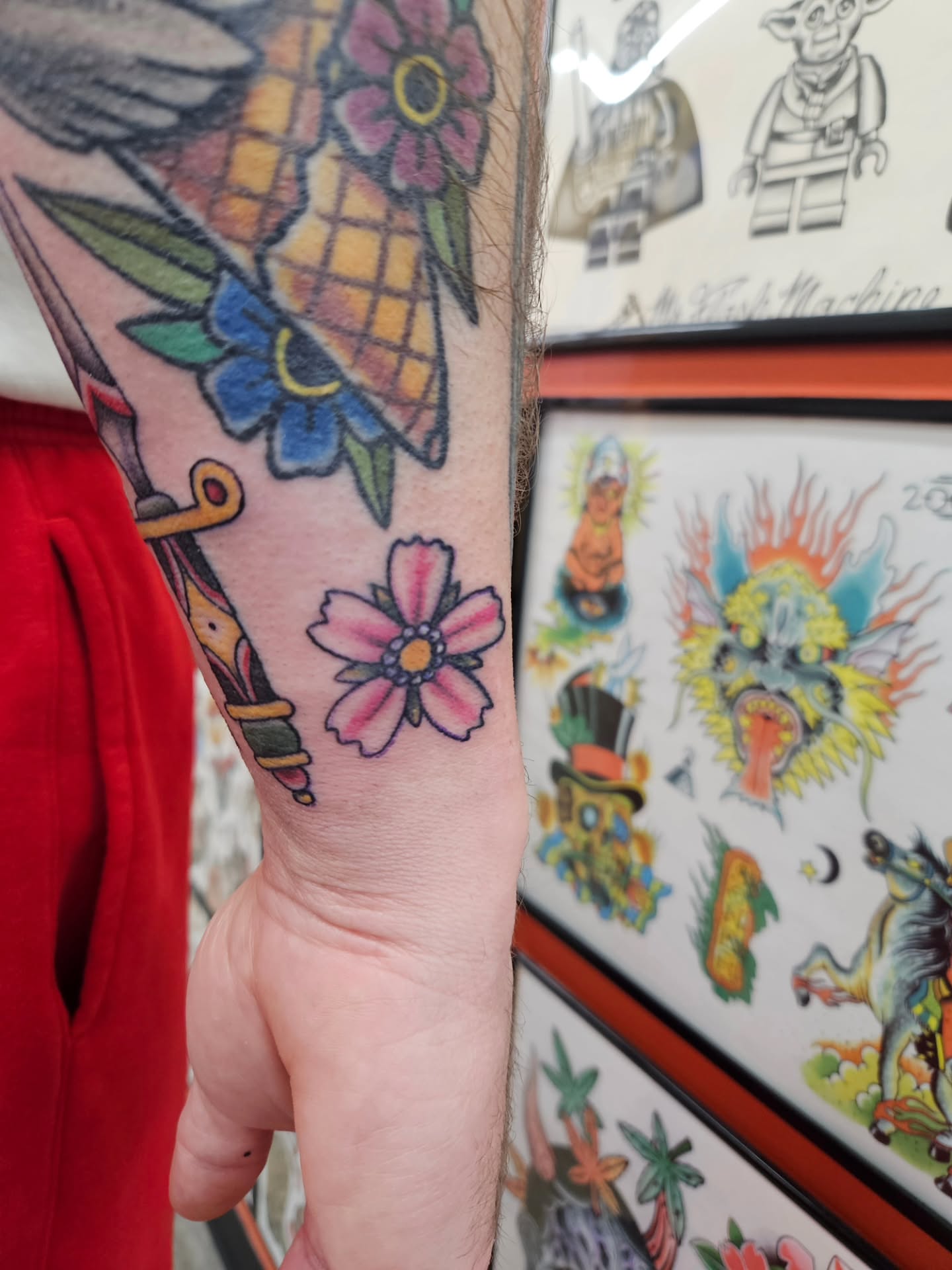 Flower American traditional tattoo on the forearm by MK Stevens - Greeley Based Tattoo Artist