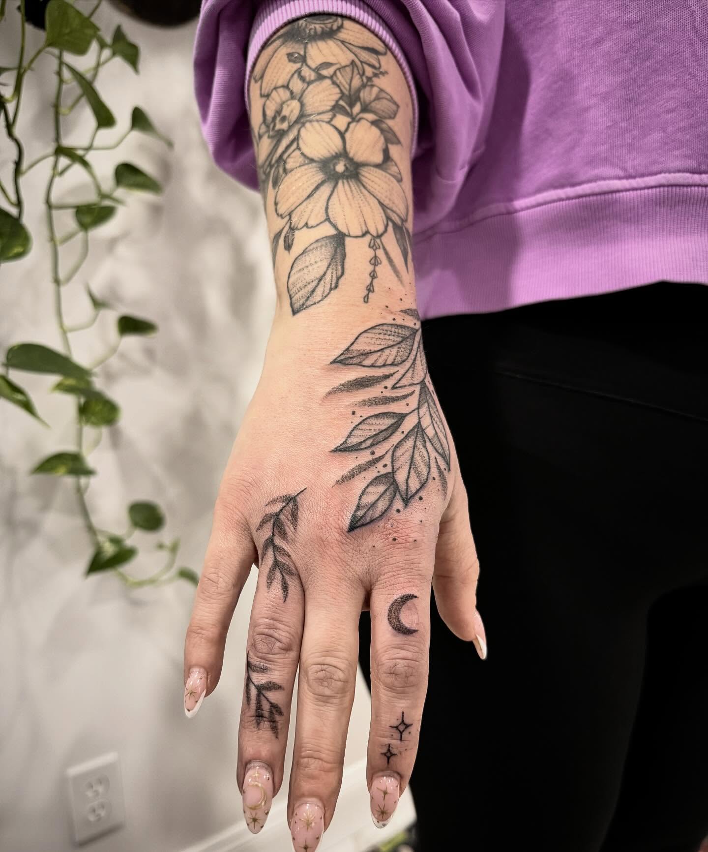 Floral hand tattoo dotwork tattoo on the hand by Shannon Misitano