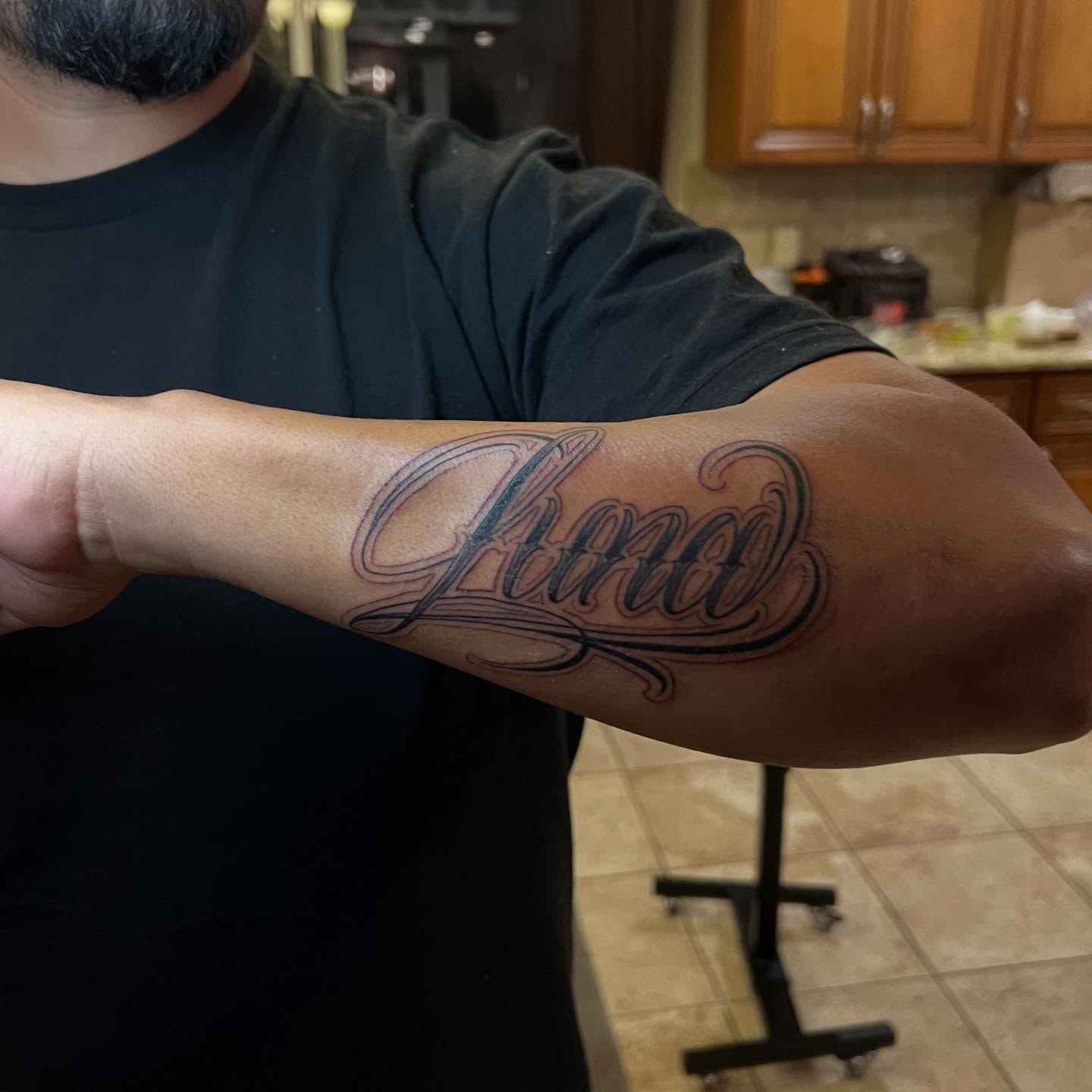 Tattoo by @jusan.tattoos — lettering_script