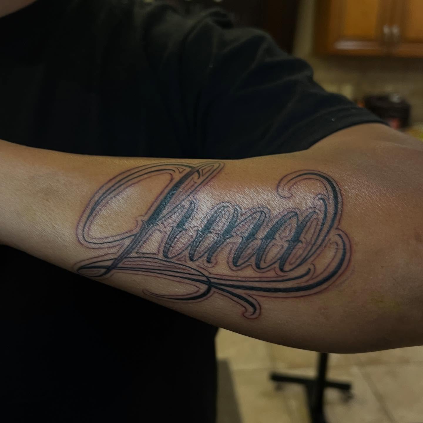 Tattoo by @jusan.tattoos — lettering_script