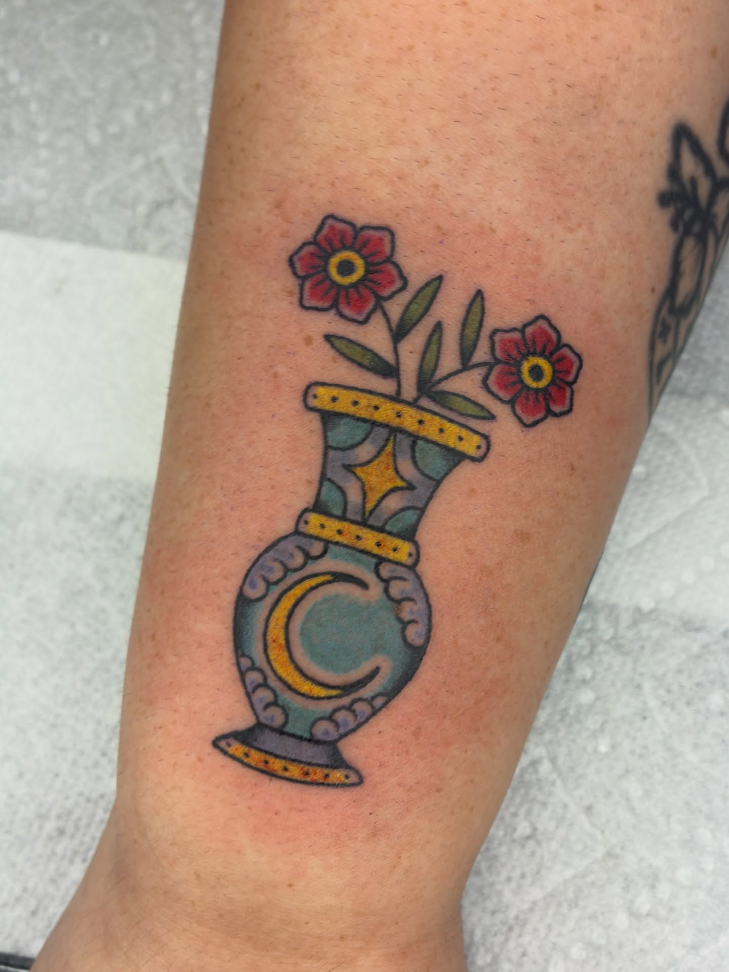 Vase with flowers American traditional tattoo on the forearm by Lance 🦈
