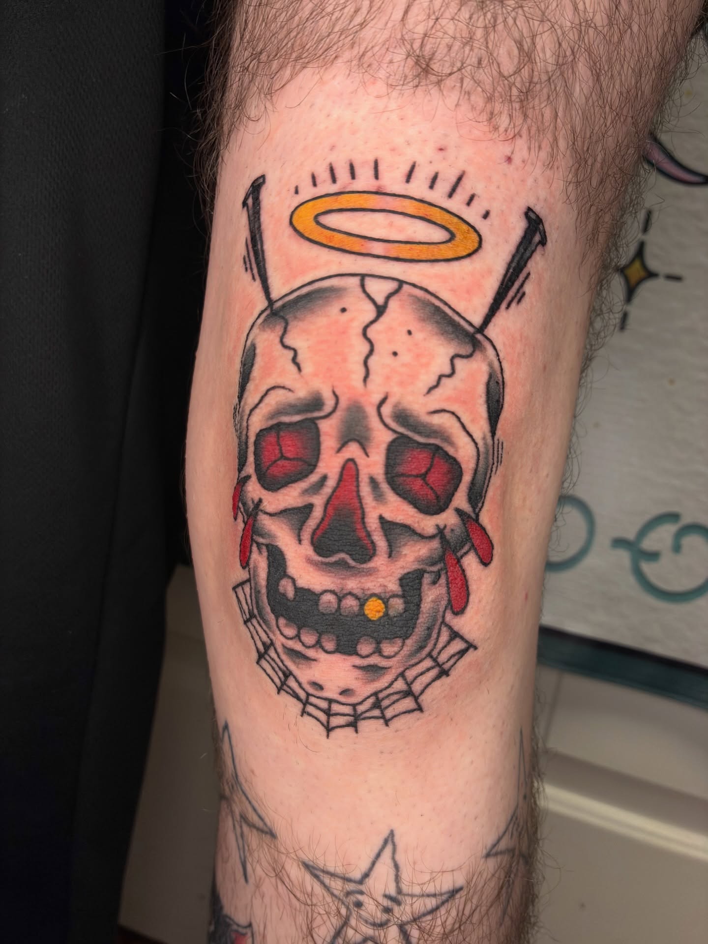 Skull with halo American traditional tattoo on the forearm by Lance 🦈