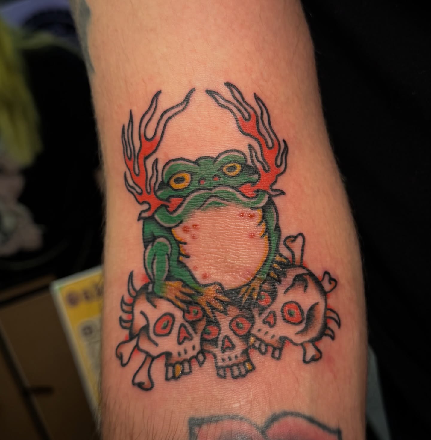Frog with skulls American traditional tattoo on the forearm by abbey pickens 🧚 cleveland ohio