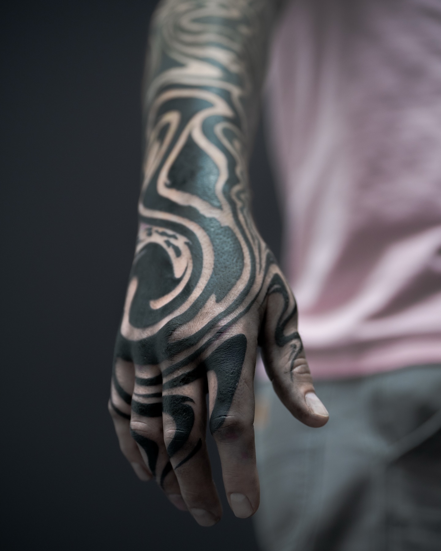 Abstract swirls black and grey tattoo on the hand by Katie Mizuno, Berkeley, California