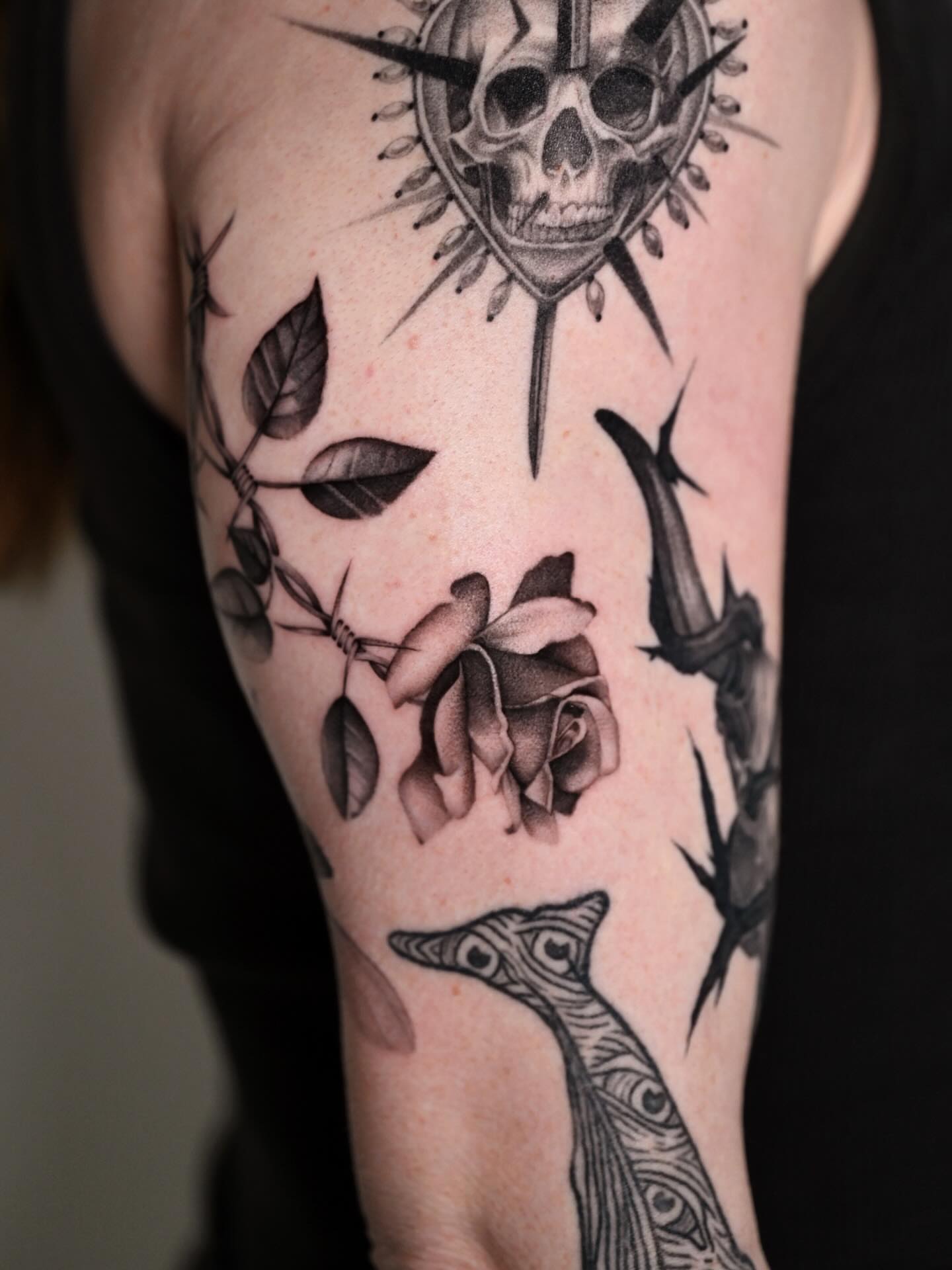 Skull and rose realism tattoo on the forearm by dom