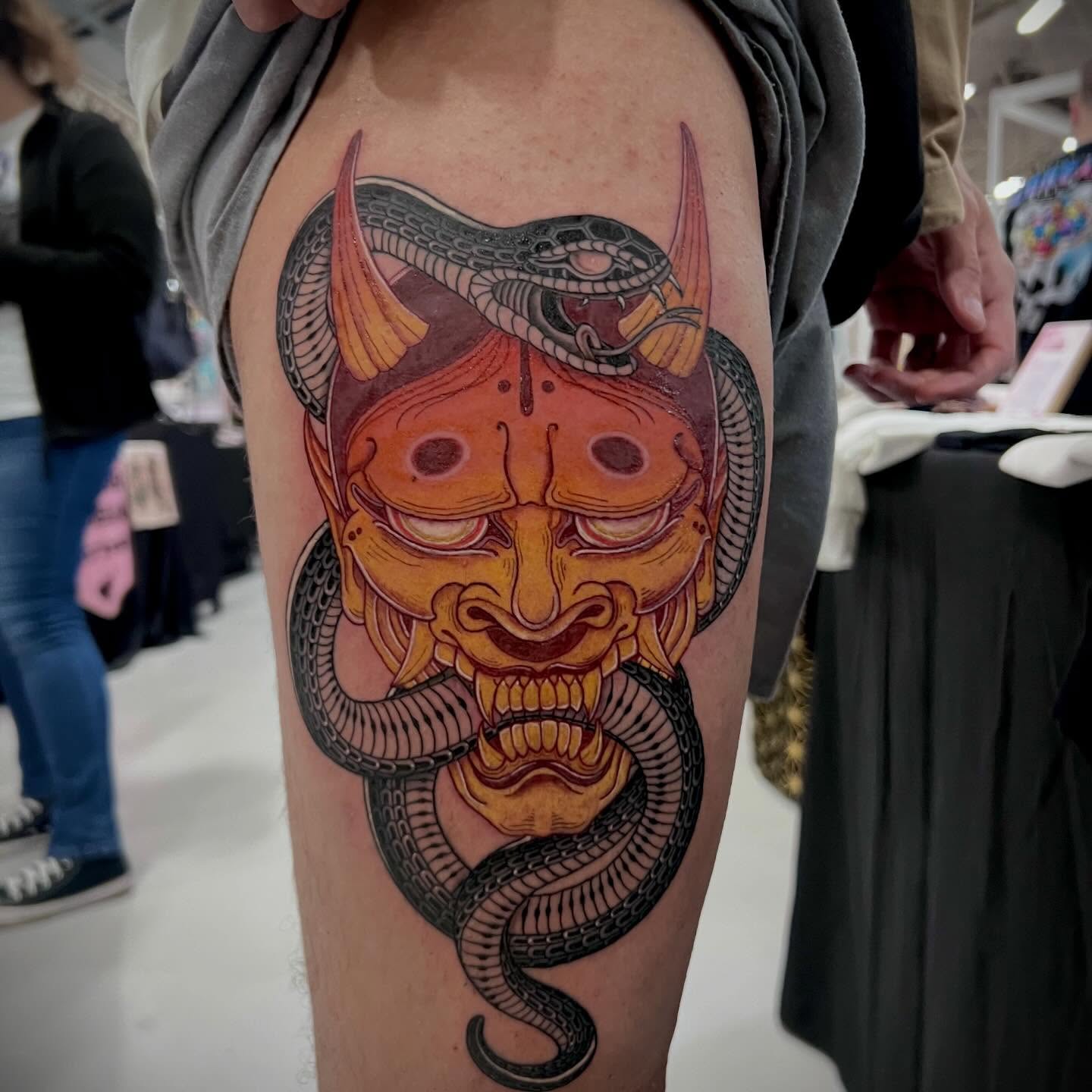 Demon mask with snake japanese irezumi tattoo on the forearm by Eoghann McGregor