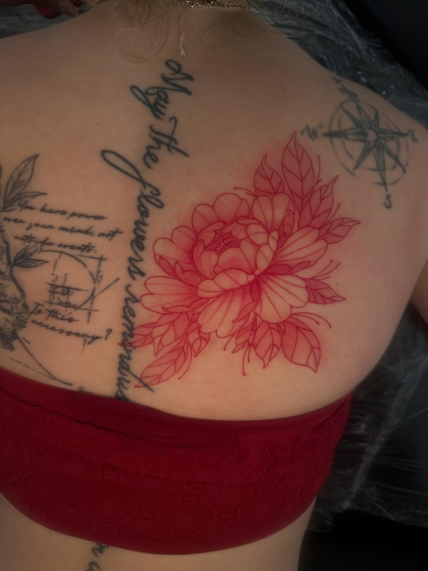 Red flower new school tattoo on the back by Cherry Tats🍒
