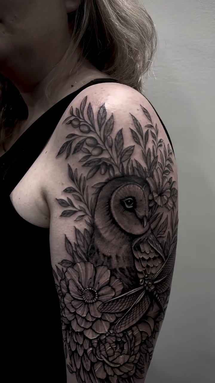 Owl with flowers and dragonfly realism tattoo by Tattoo Ottawa