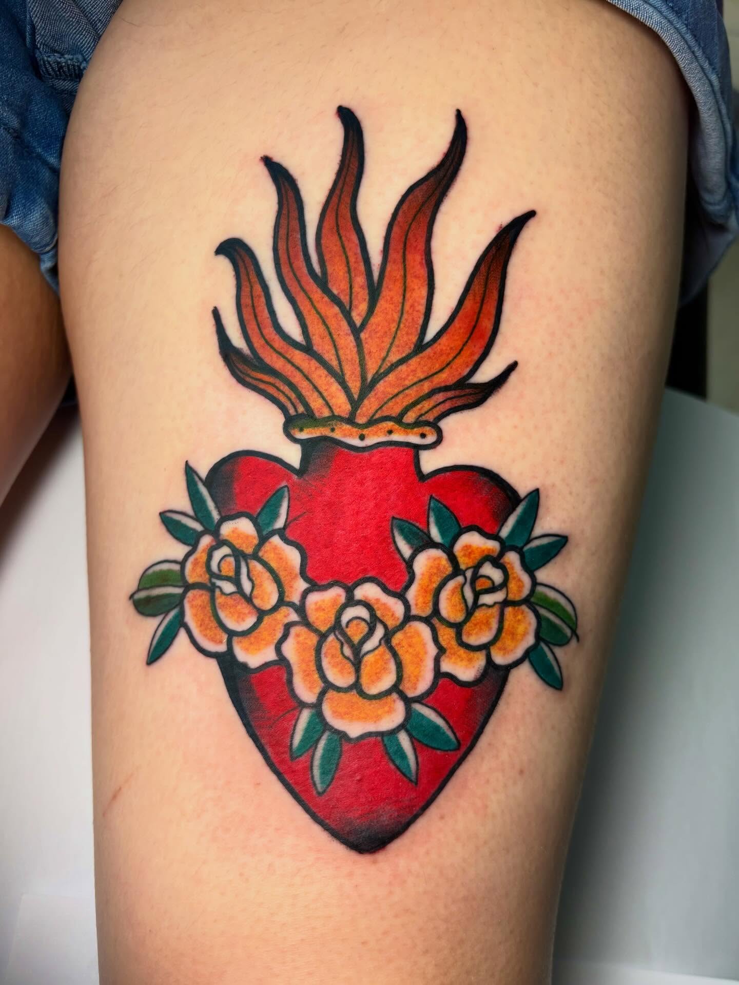 Heart with flames and roses American traditional tattoo on the thigh by ✶ 𝑺𝑰𝑳𝑽𝑨𝑵𝑨
