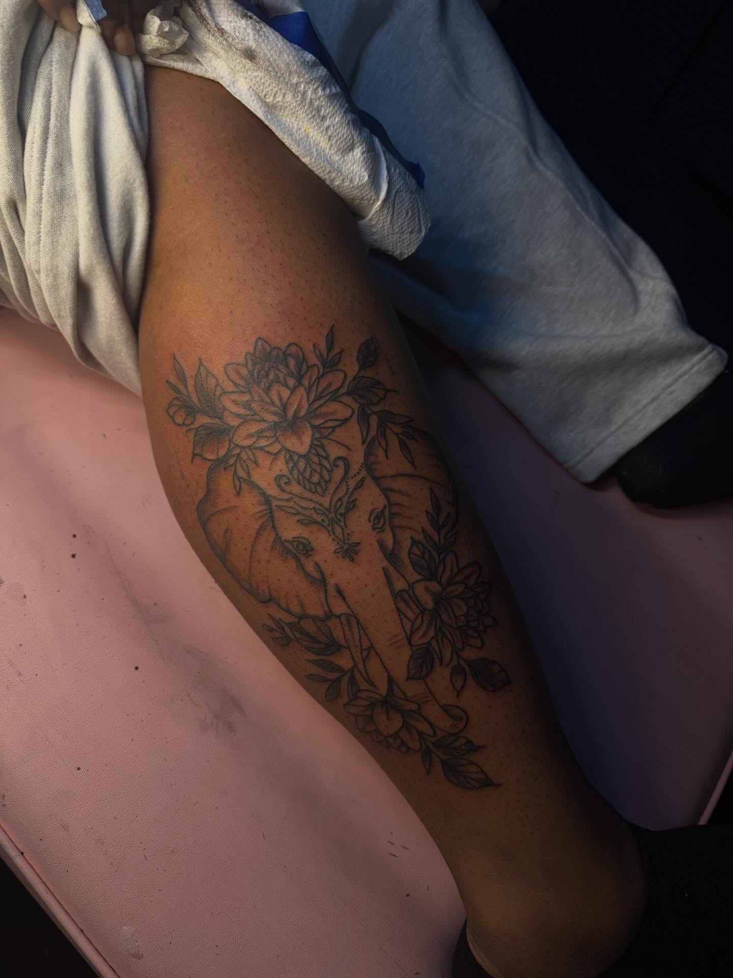 Floral bouquet black and grey tattoo on the forearm by Tatted By Layy