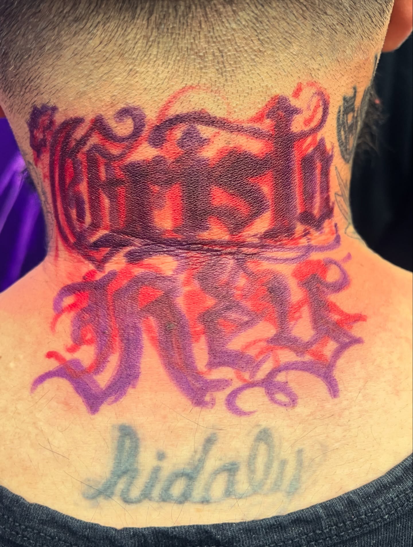 Script lettering lettering script tattoo on the neck by F e A R