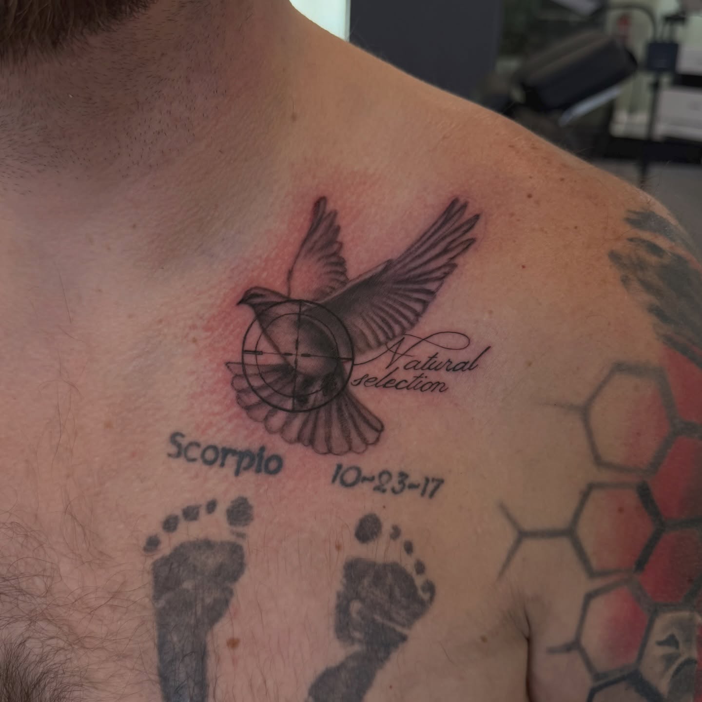 Bird and compass geometric tattoo on the chest by utah tattoo artist