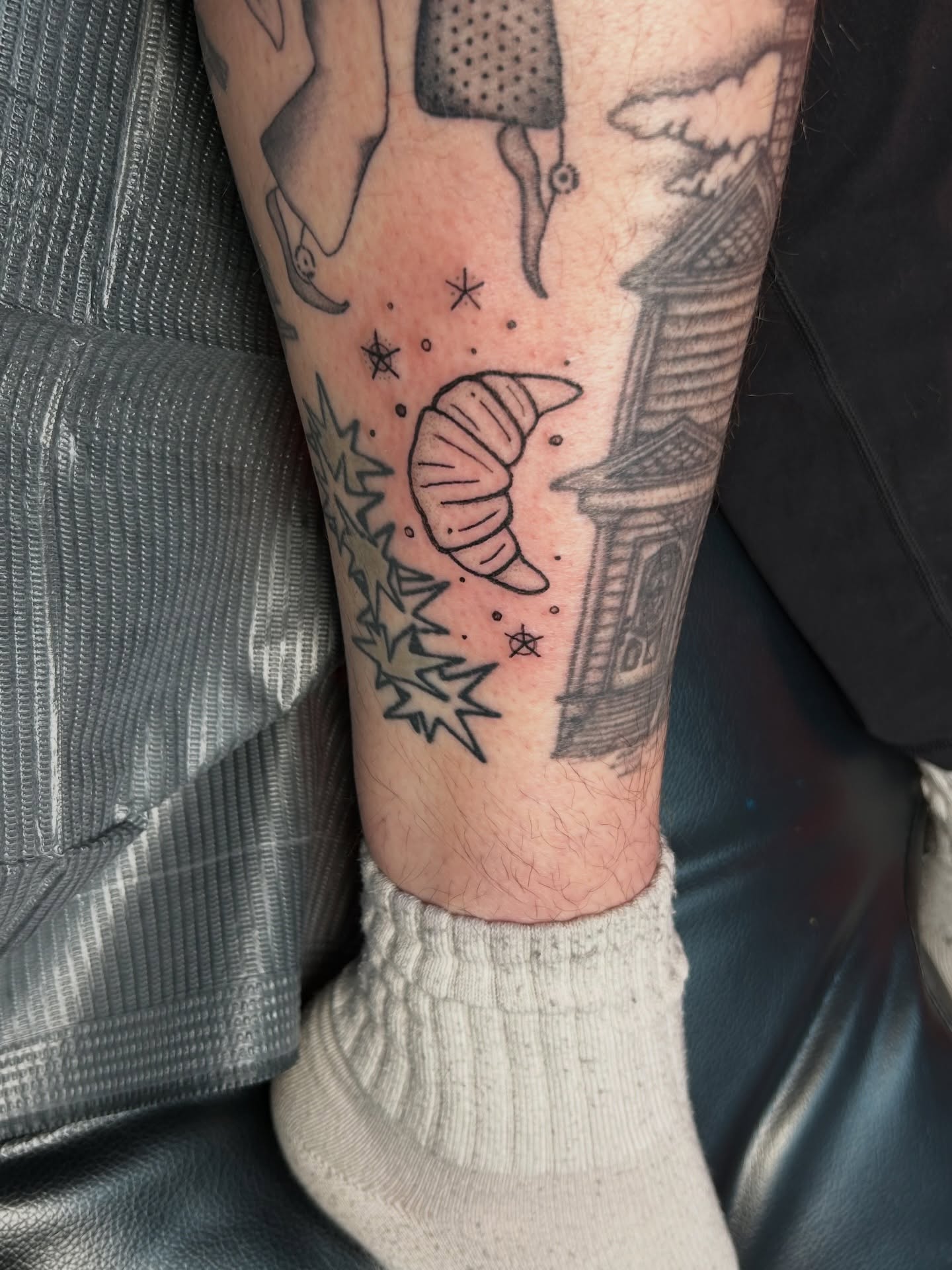 Croissant and stars dotwork tattoo on the forearm by Rachel