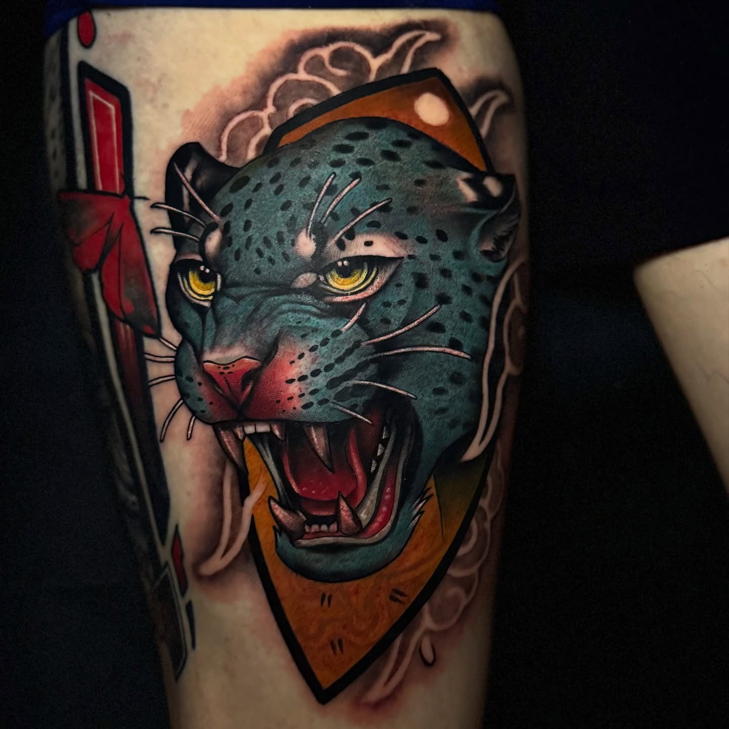 Roaring jaguar American traditional tattoo on the forearm by Jaxx Kesler